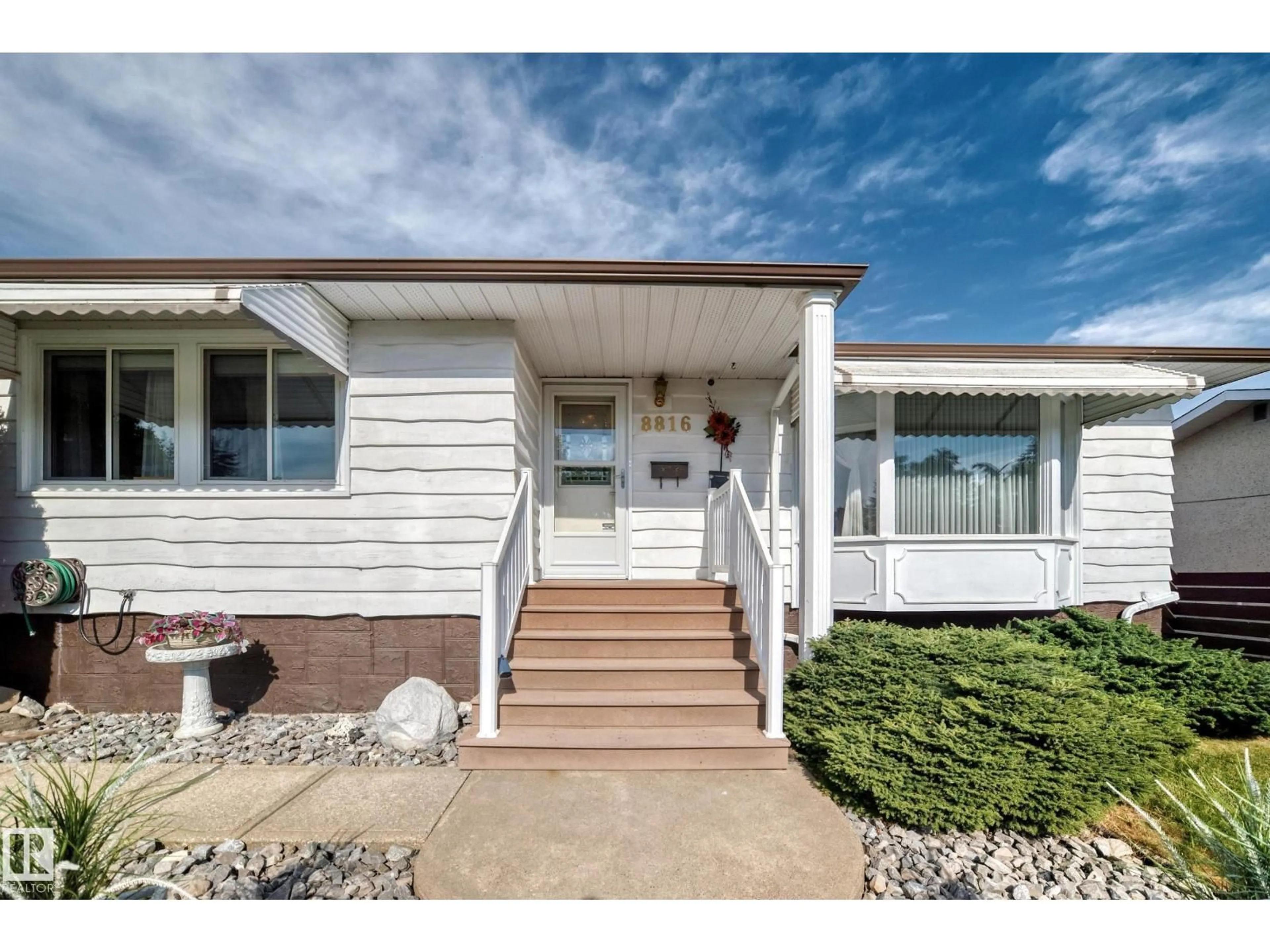 Home with vinyl exterior material, street for 8816 131A AV NW, Edmonton Alberta T5E0X2