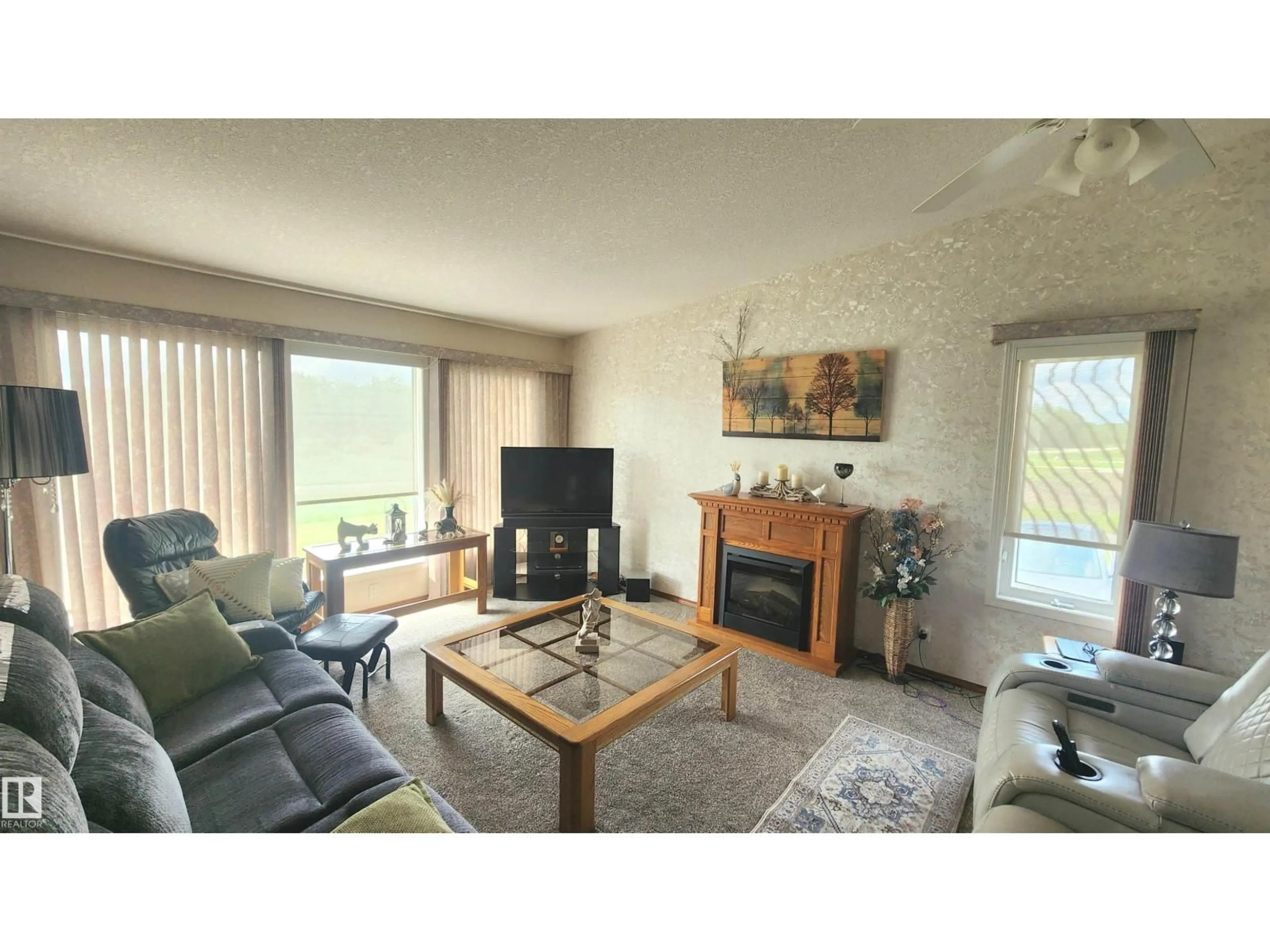 Living room with furniture, wood/laminate floor for 20120 TWP RD 515, Rural Beaver County Alberta T0B4J1