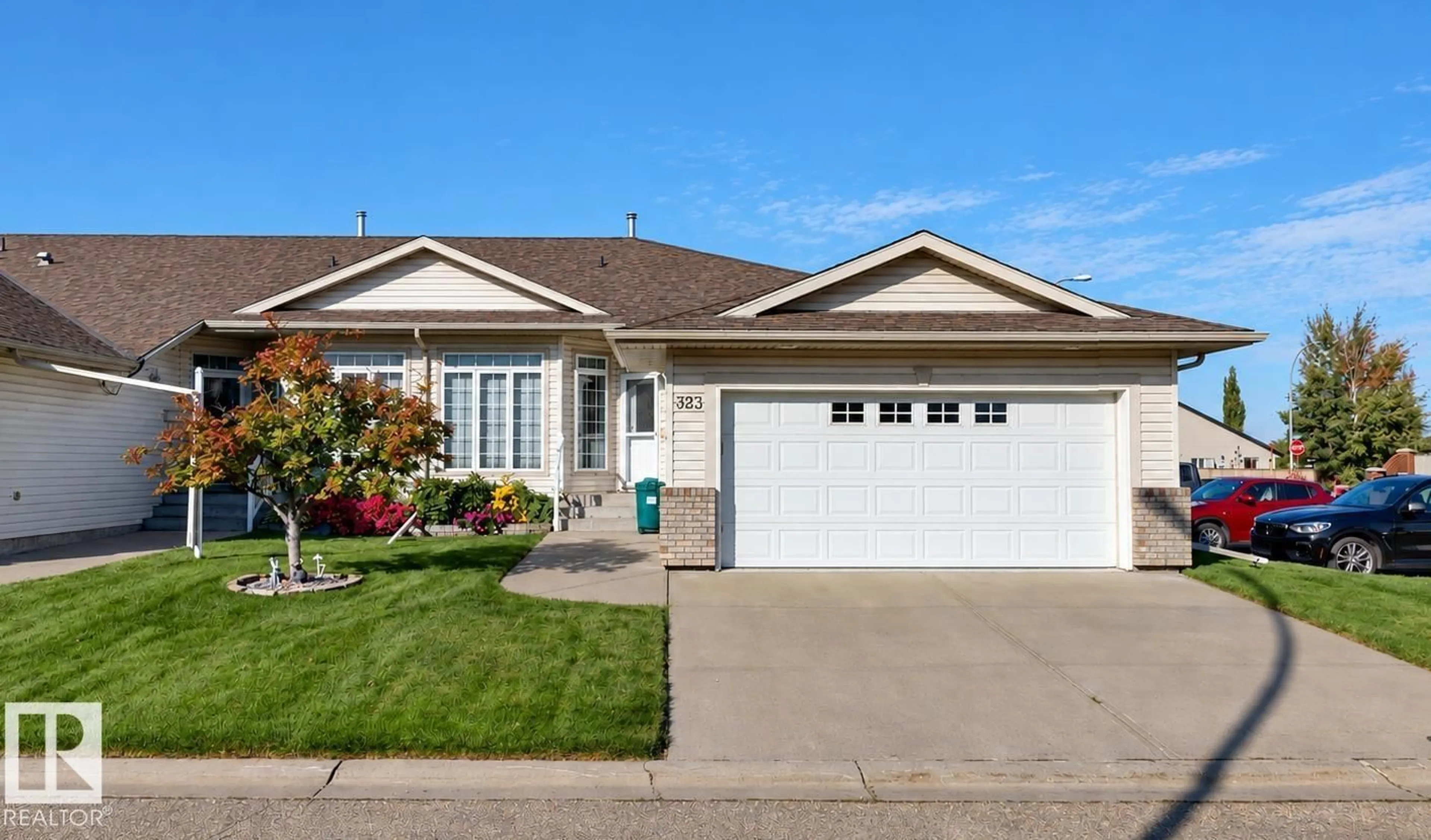 Home with vinyl exterior material, street for 323 RAVINE VILLAS, Leduc Alberta T9E8H3