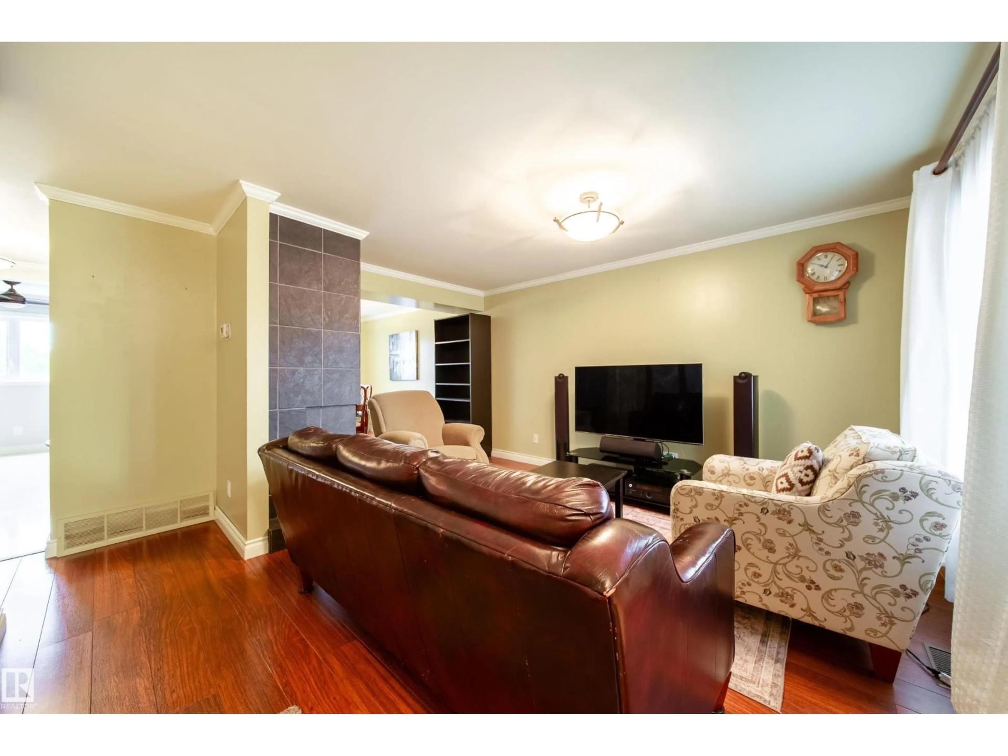 Living room with furniture, wood/laminate floor for 5 11111 26 AV NW, Edmonton Alberta T6J5M7