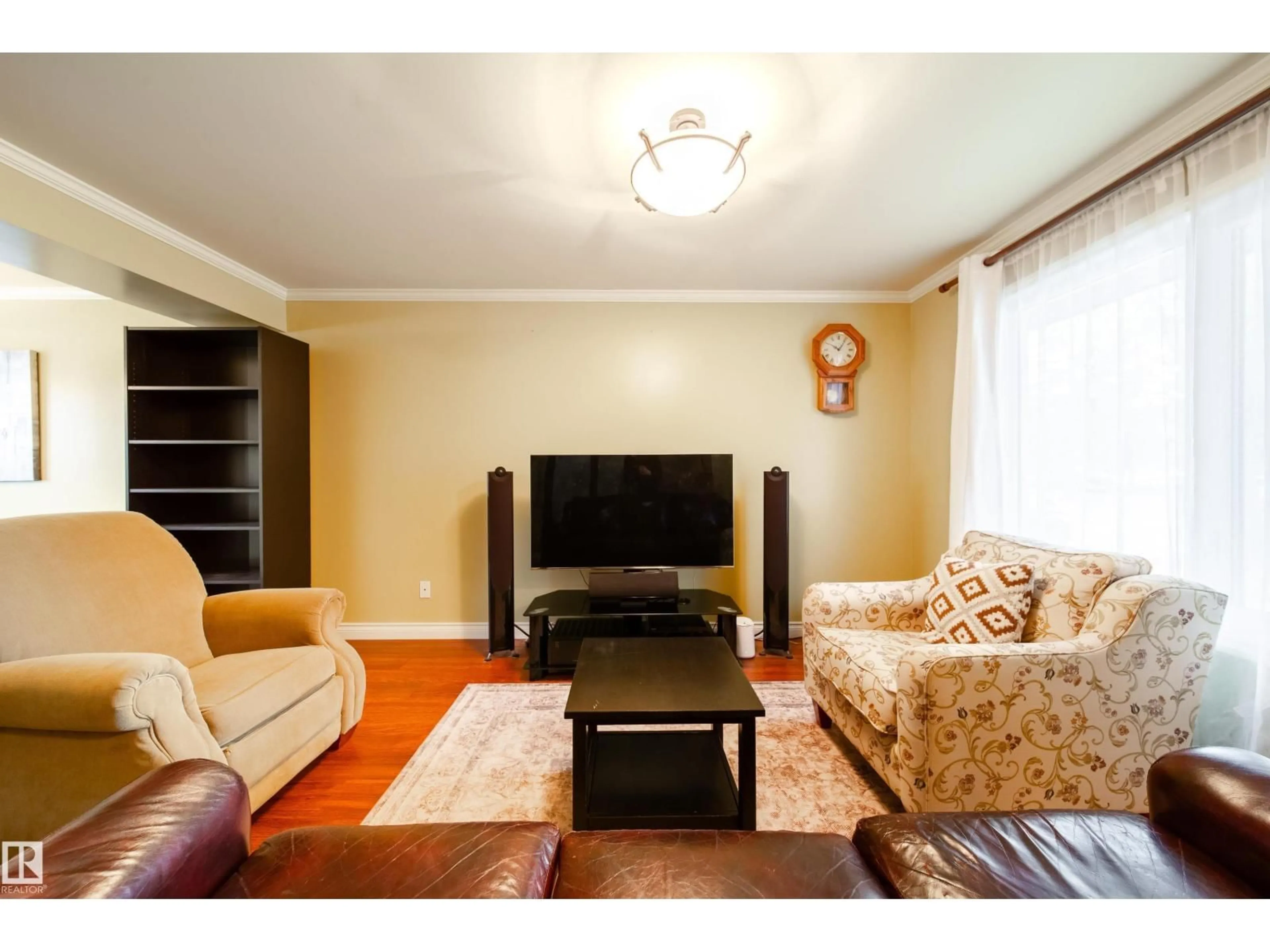 Living room with furniture, wood/laminate floor for 5 11111 26 AV NW, Edmonton Alberta T6J5M7