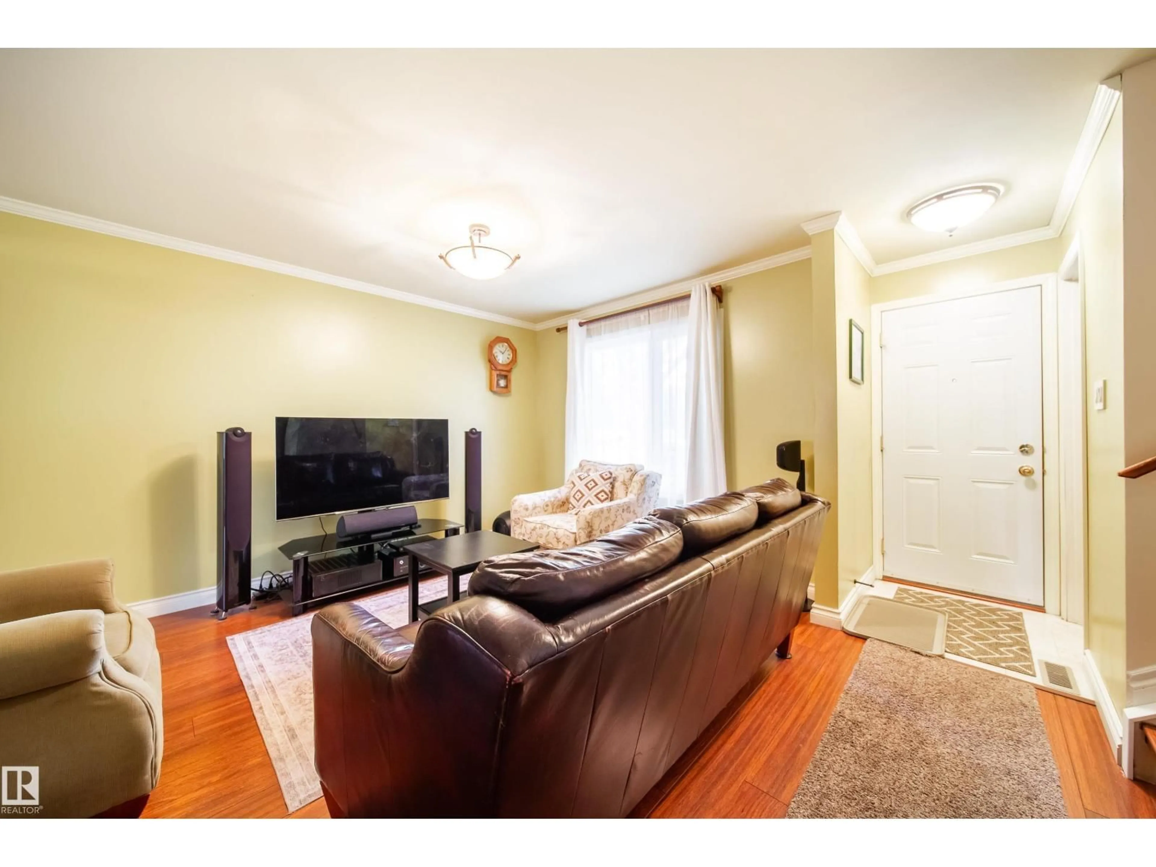 Living room with furniture, wood/laminate floor for 5 11111 26 AV NW, Edmonton Alberta T6J5M7