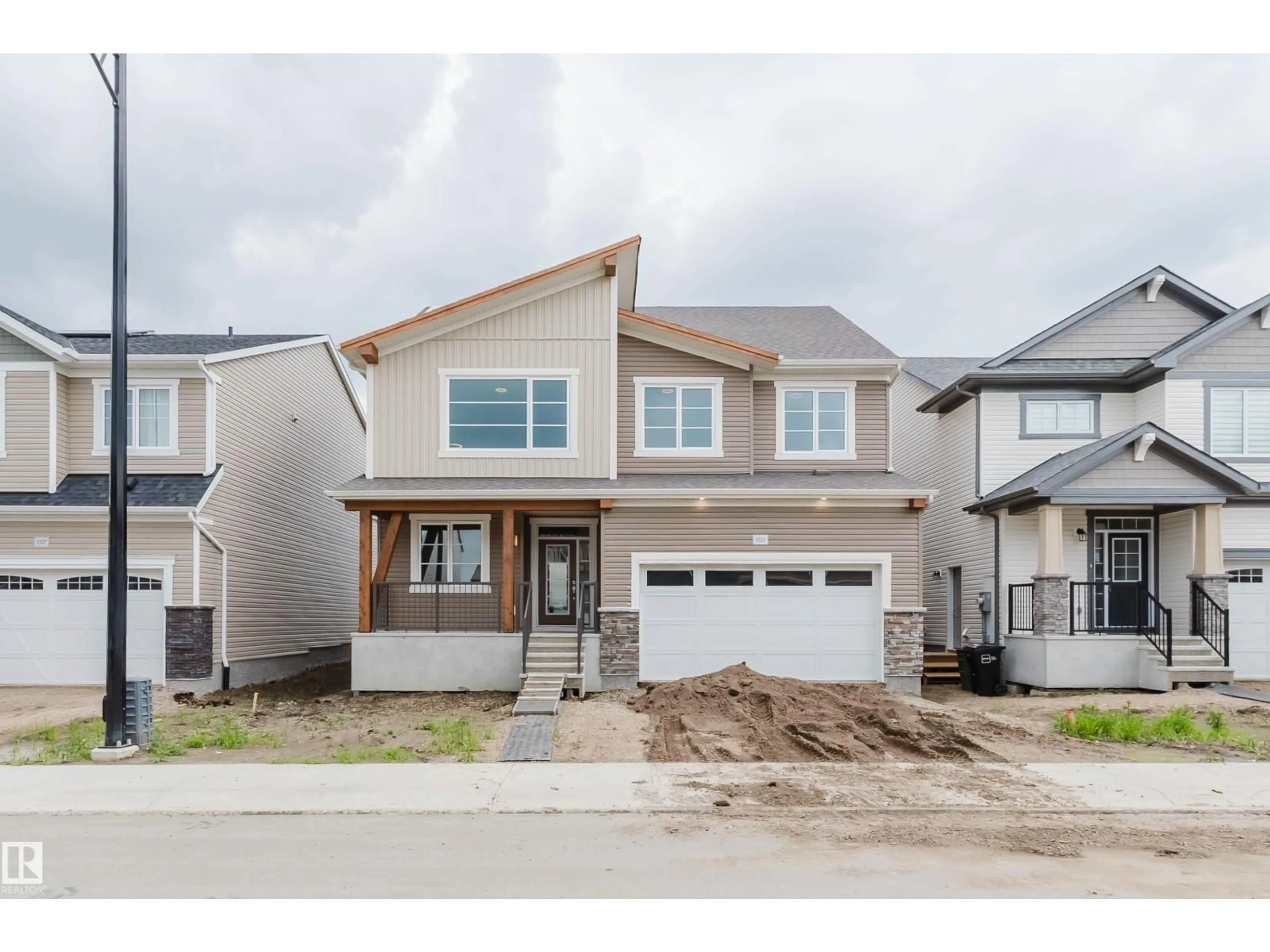 Home with vinyl exterior material, street for NW - 1523 206 ST, Edmonton Alberta T6M2X6