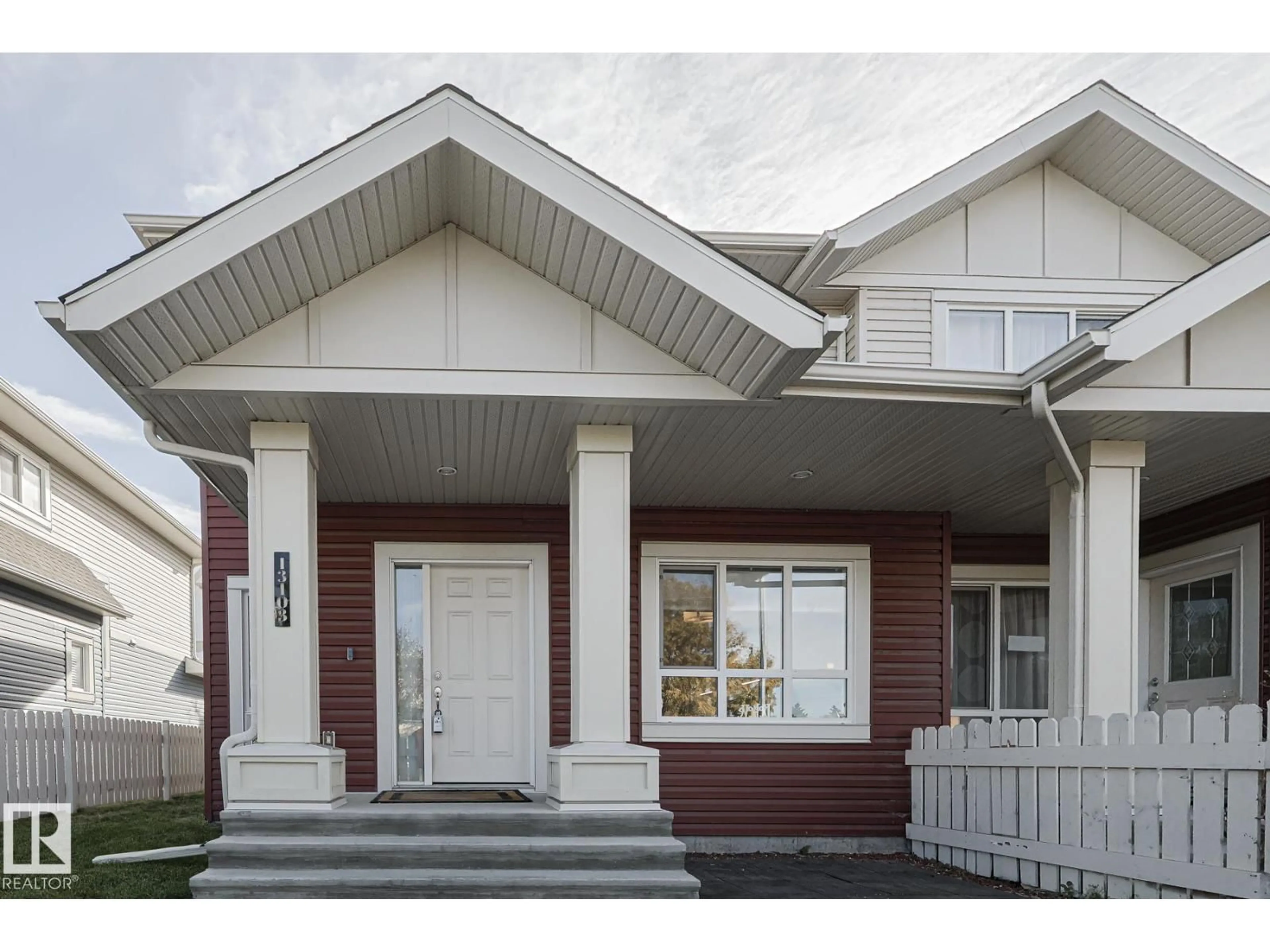 Home with vinyl exterior material, street for NW - 13103 132 AV, Edmonton Alberta T5L3R2