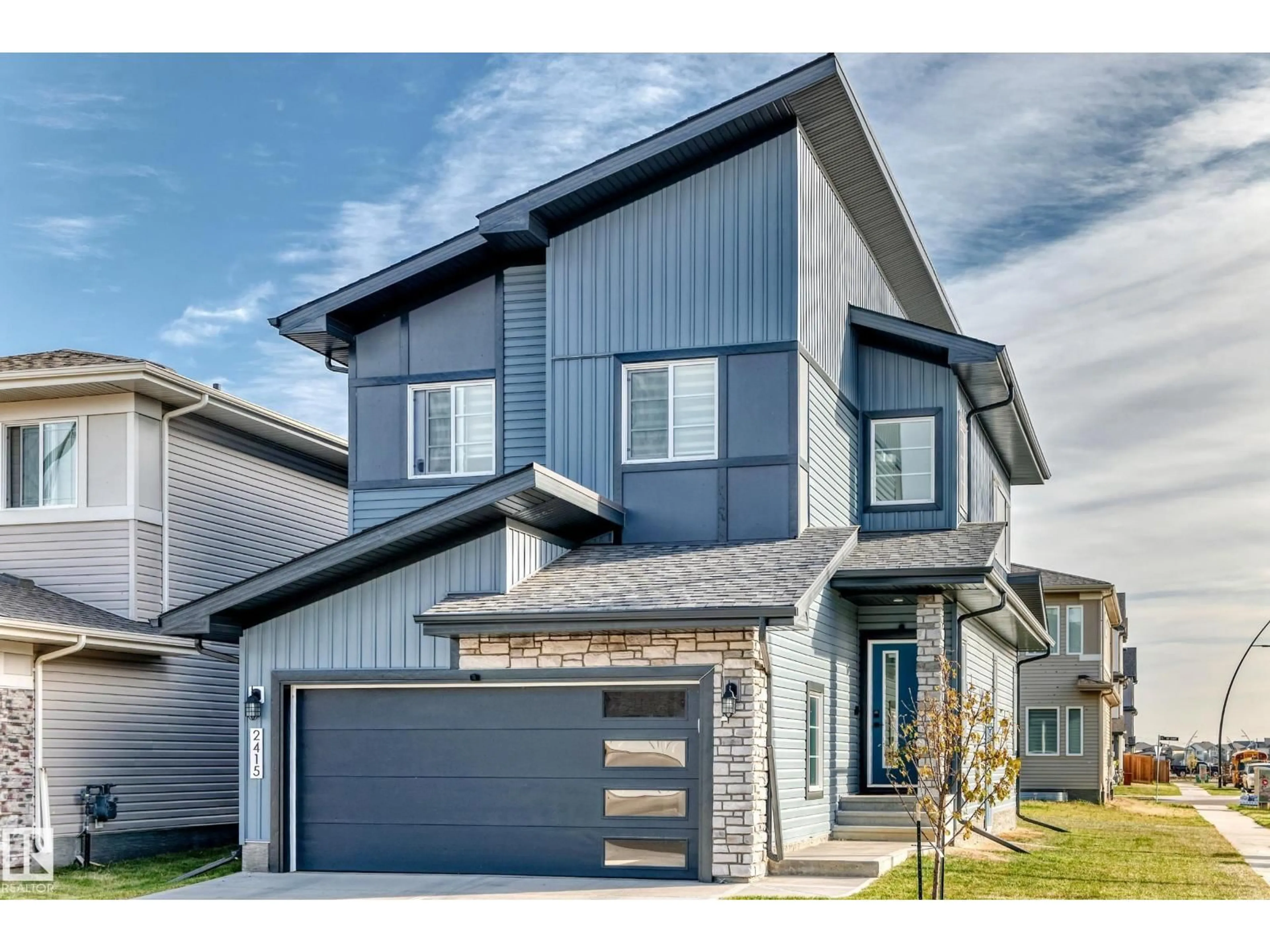 Home with vinyl exterior material, street for NW - 2415 194 ST, Edmonton Alberta T6M1P5