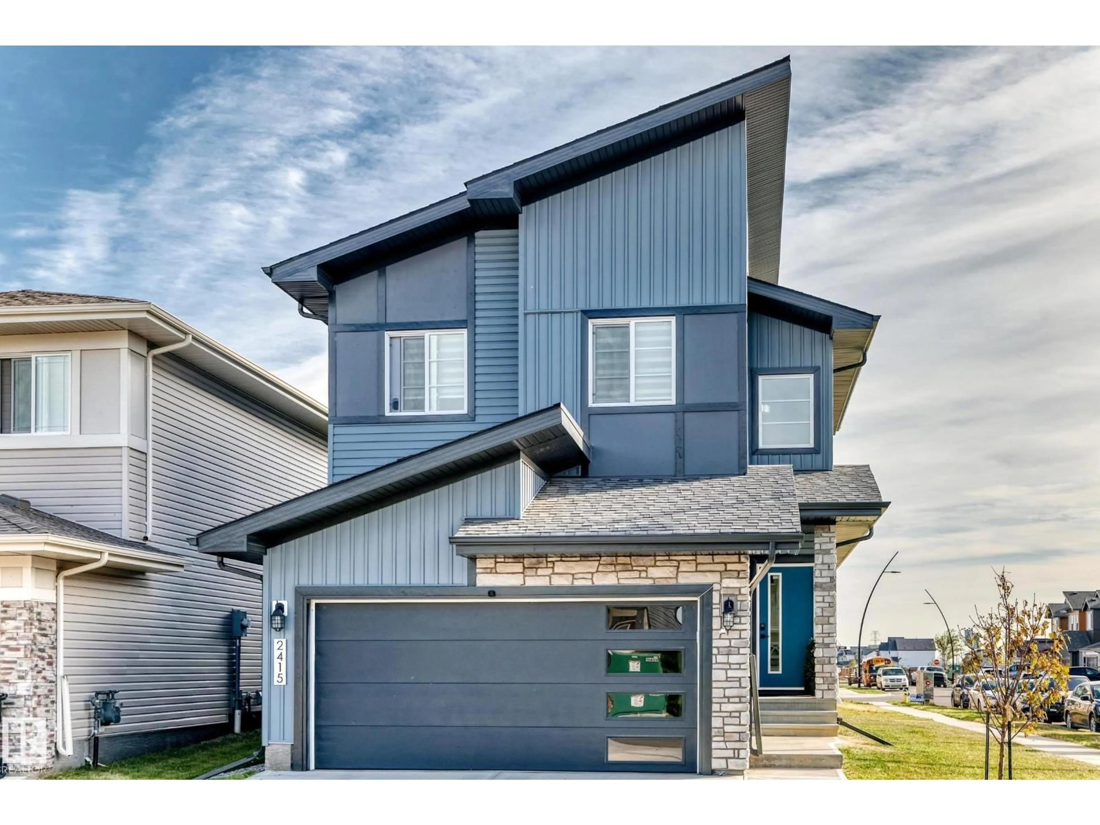 Home with vinyl exterior material, street for NW - 2415 194 ST, Edmonton Alberta T6M1P5