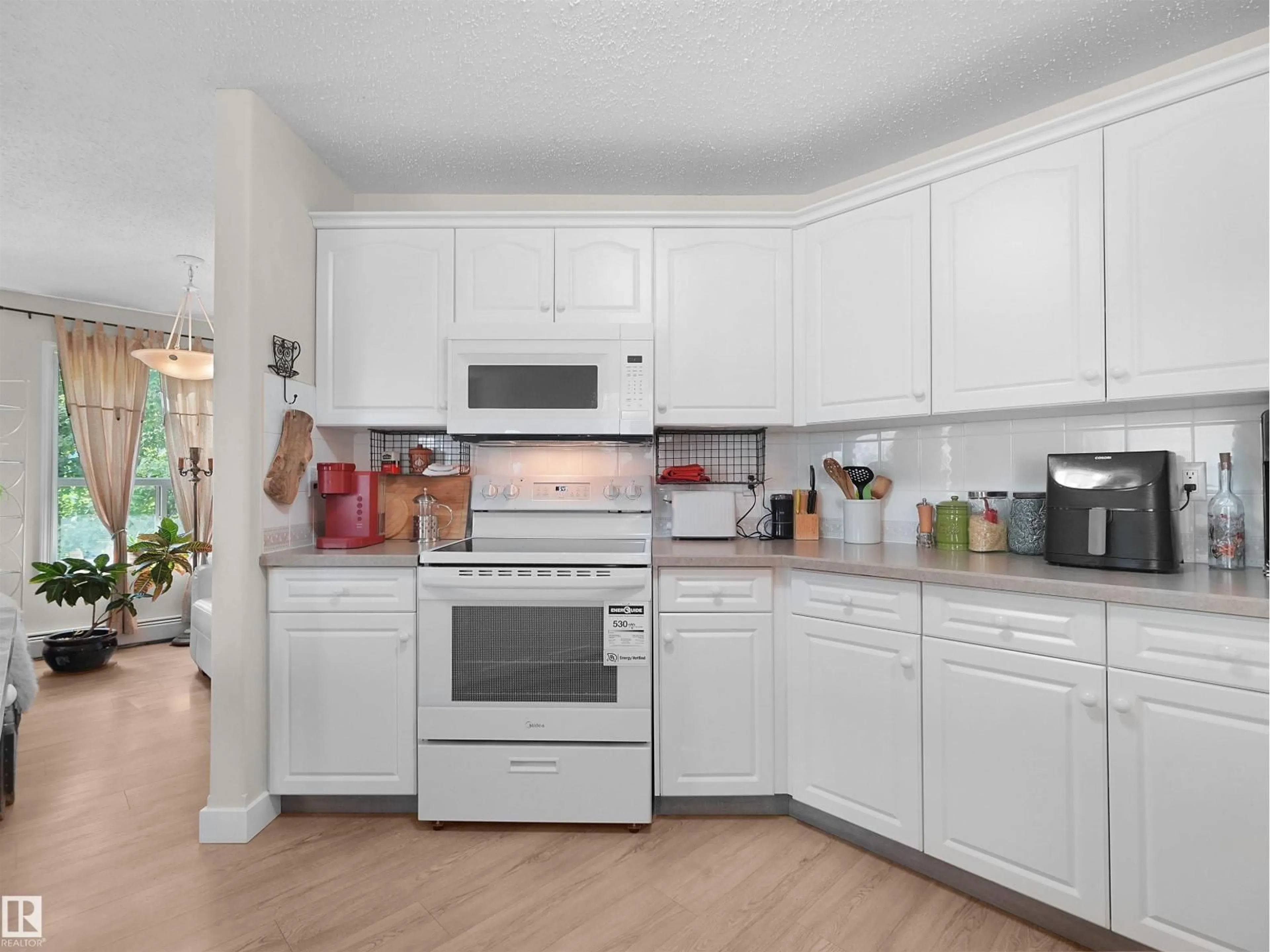 Open concept kitchen, unknown for #203 - 9760 174 ST, Edmonton Alberta T5T6J4