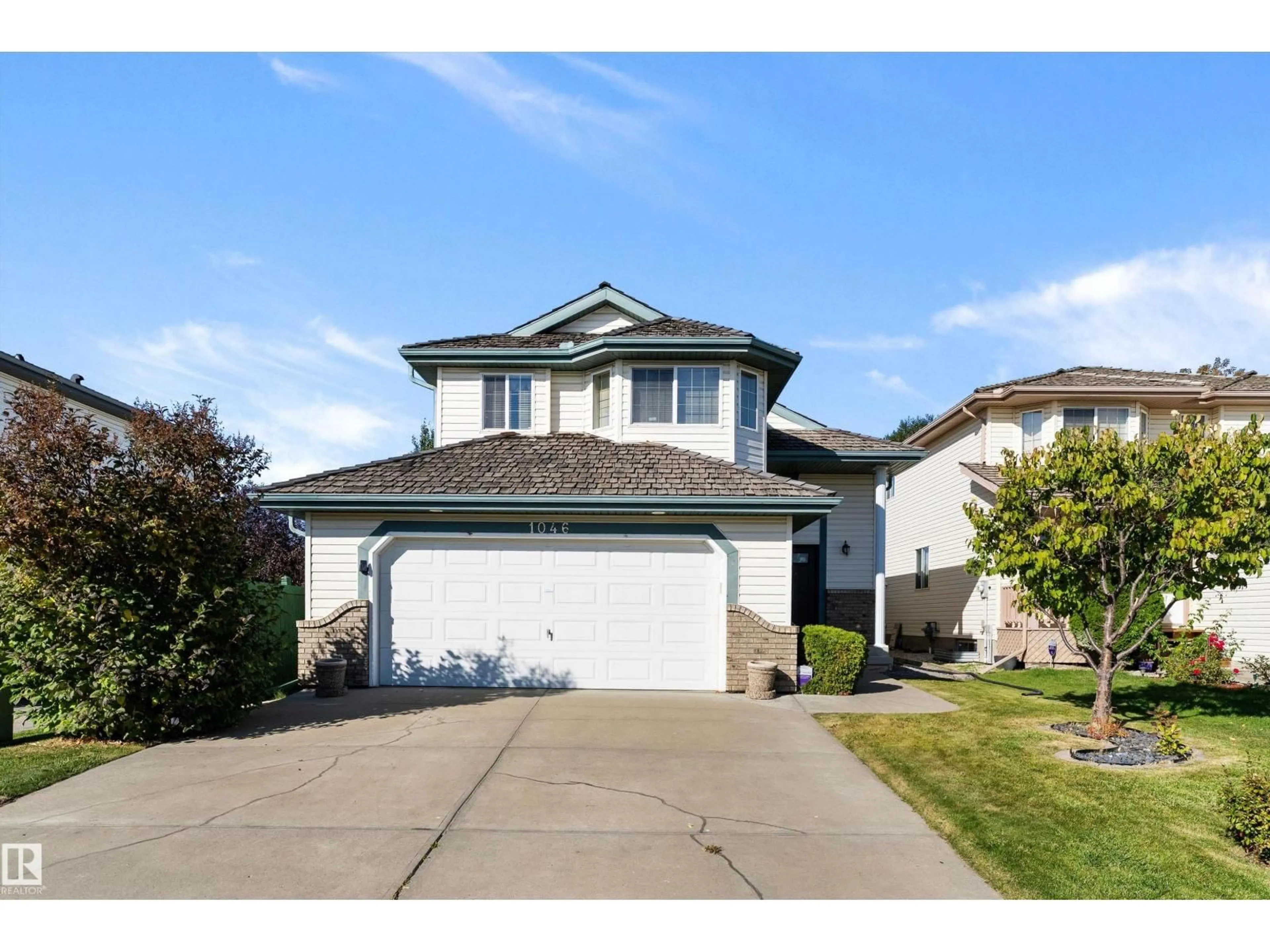 Home with vinyl exterior material, street for 1046 BLACKBURN CL, Edmonton Alberta T6W1C7