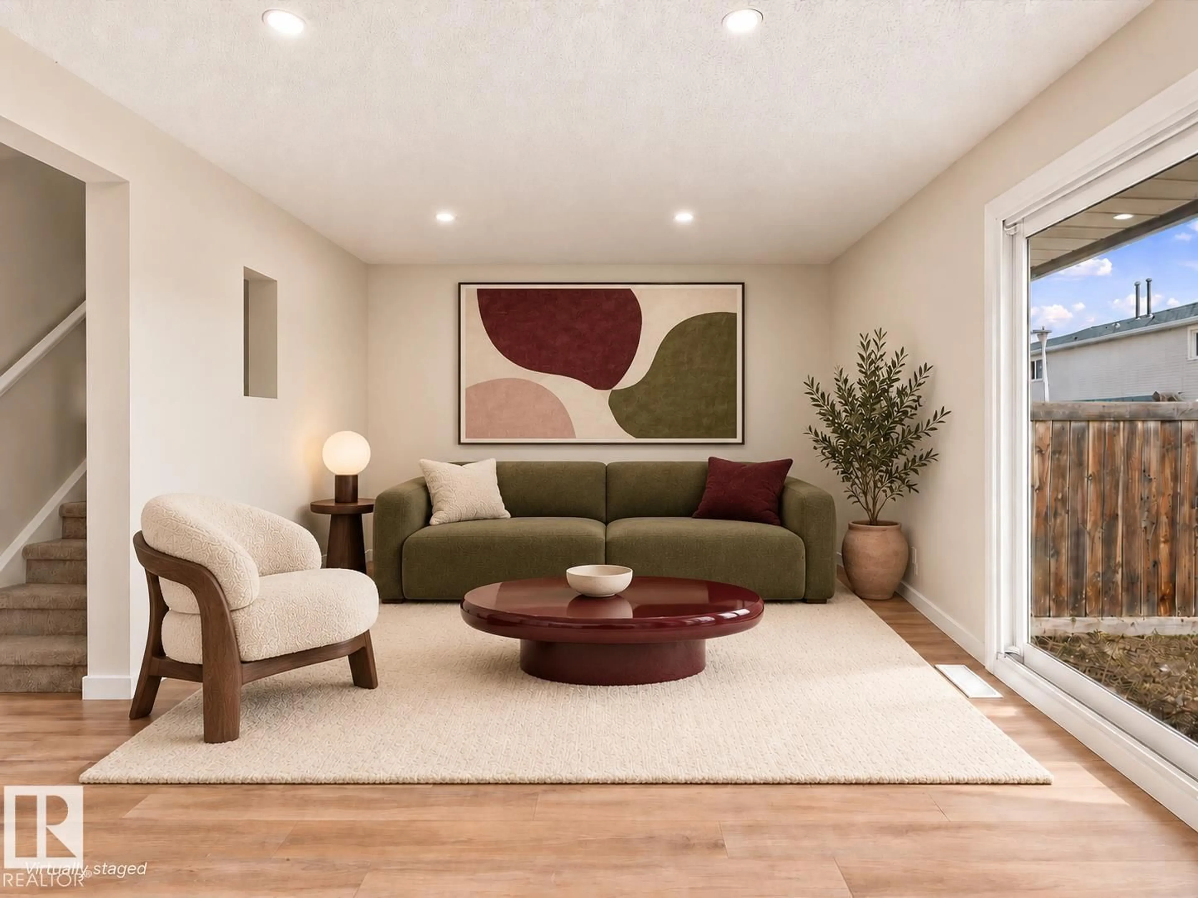 Living room with furniture, wood/laminate floor for 18325 66 AV, Edmonton Alberta T5T1Z5