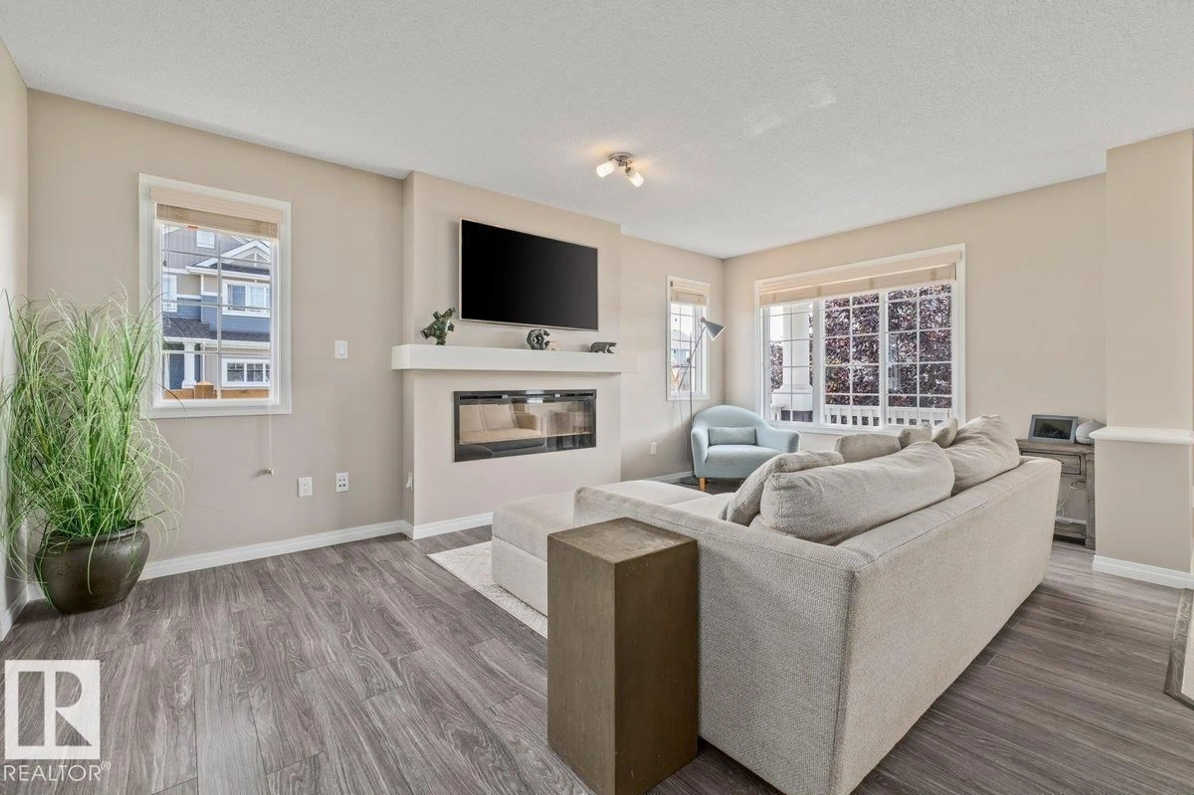 Living room with furniture, unknown for 6906 23 AV, Edmonton Alberta T6X1Z3