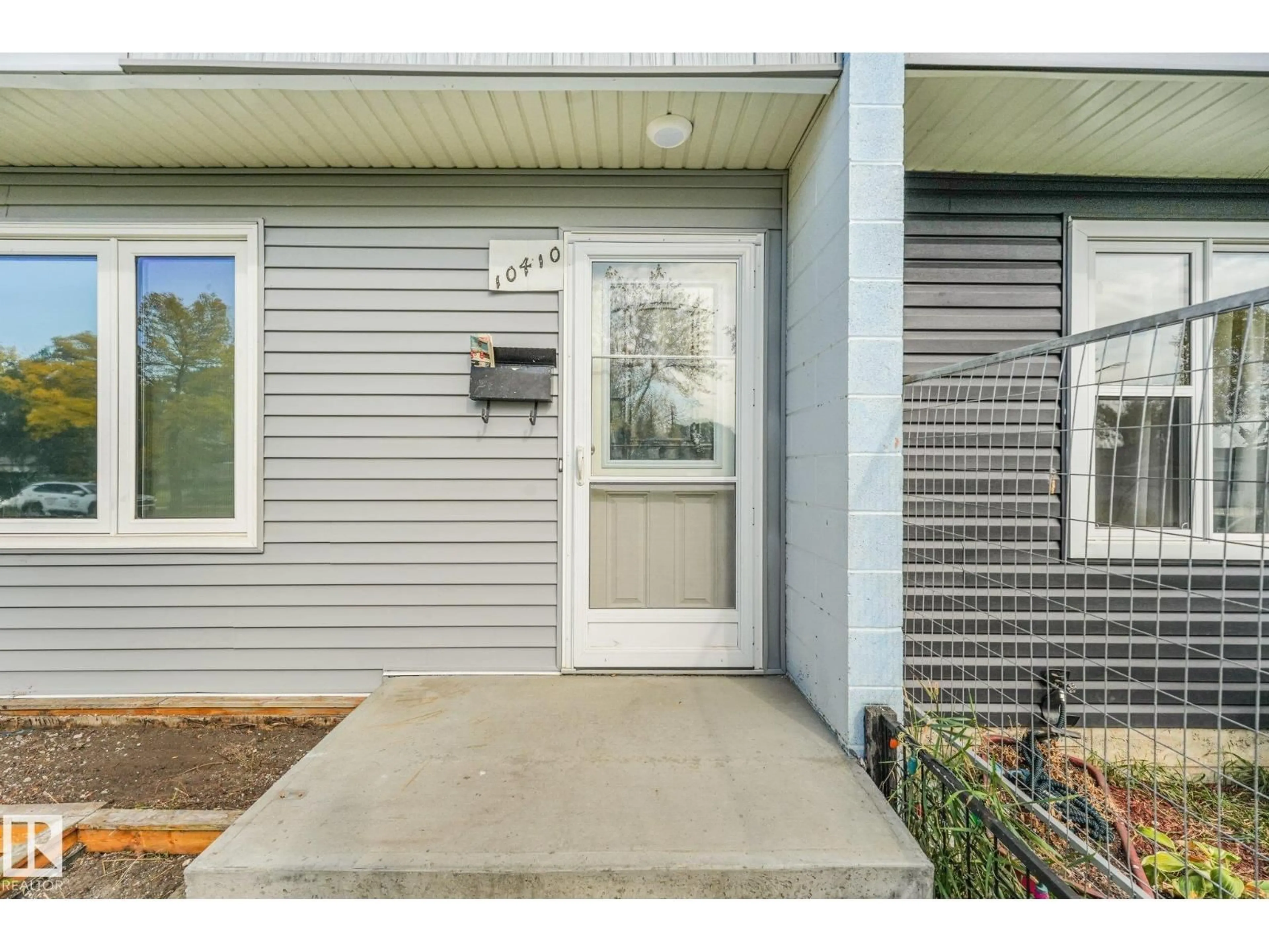 Home with vinyl exterior material, street for 10410 LAUDER AV, Edmonton Alberta T5E5P8
