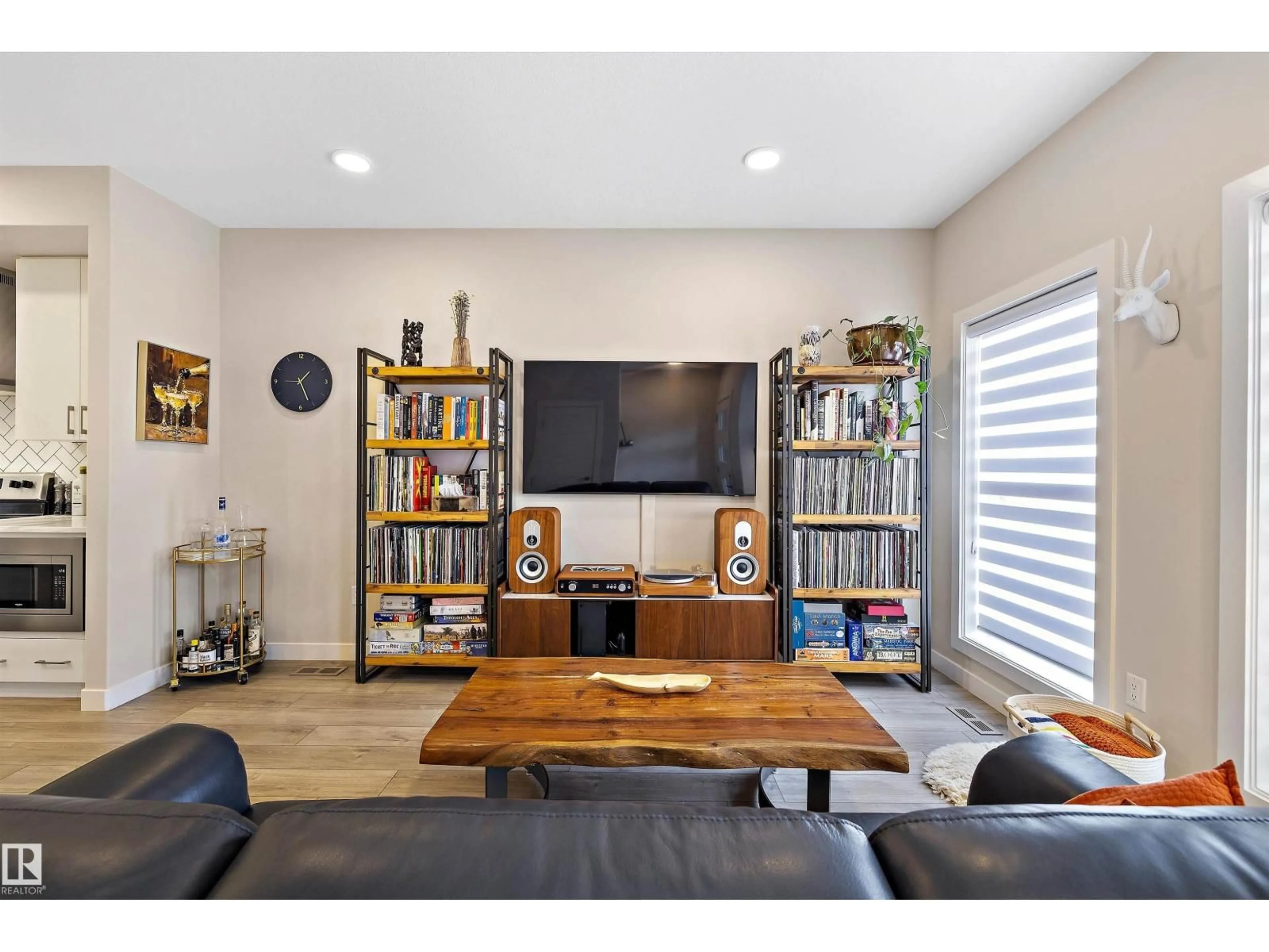 Living room with furniture, wood/laminate floor for 7817 YORKE RD, Edmonton Alberta T5G2R6