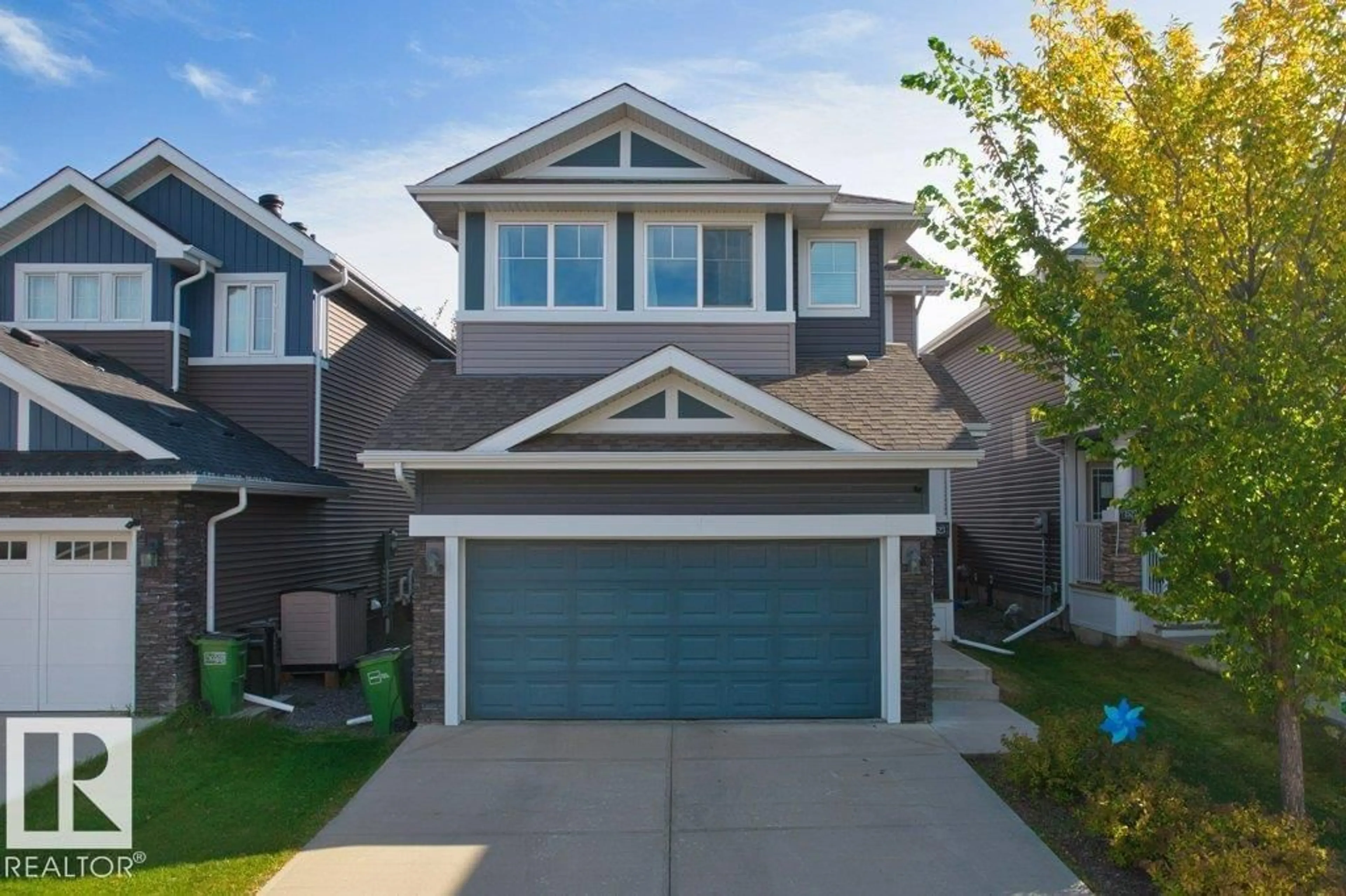 Home with vinyl exterior material, street for SW - 1523 168 ST, Edmonton Alberta T6W3R6