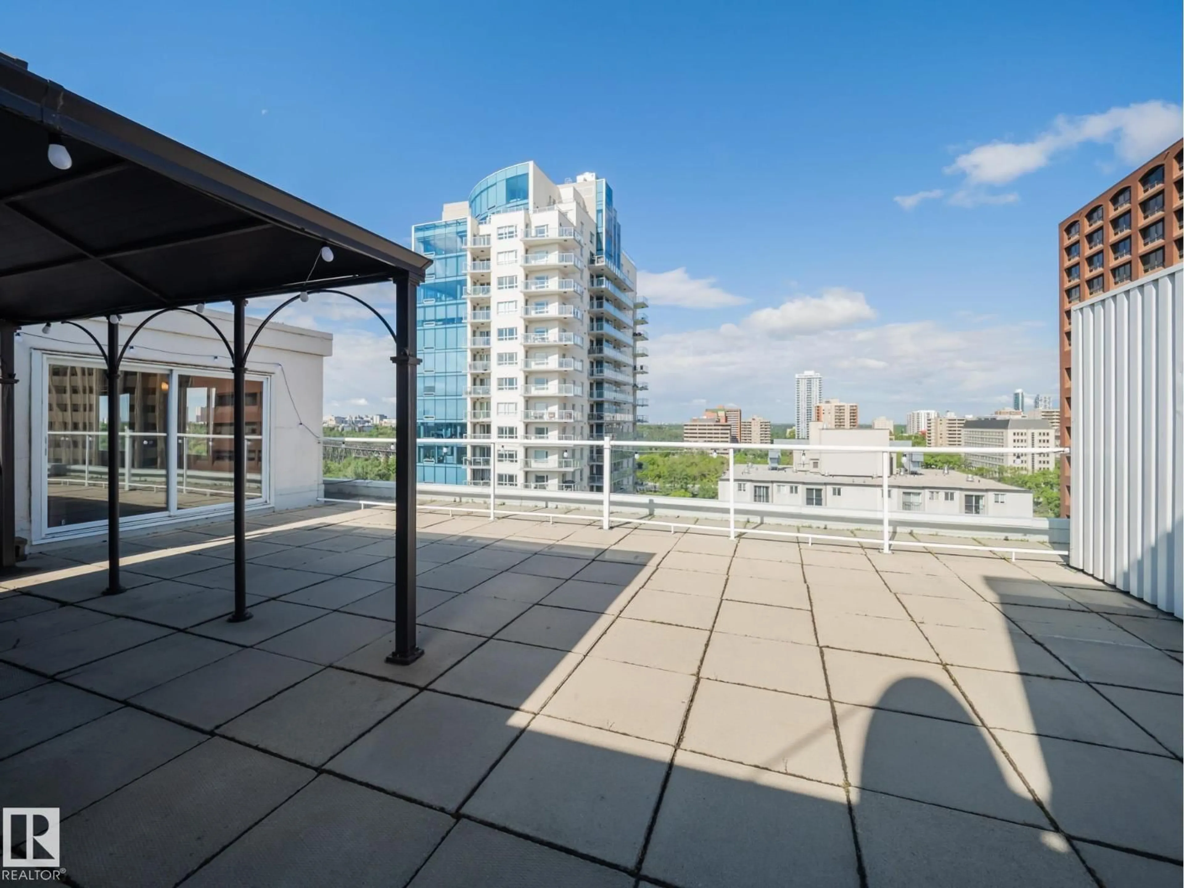 Patio, city buildings view from balcony for PH4 - 9725 106 ST, Edmonton Alberta T5K1B5