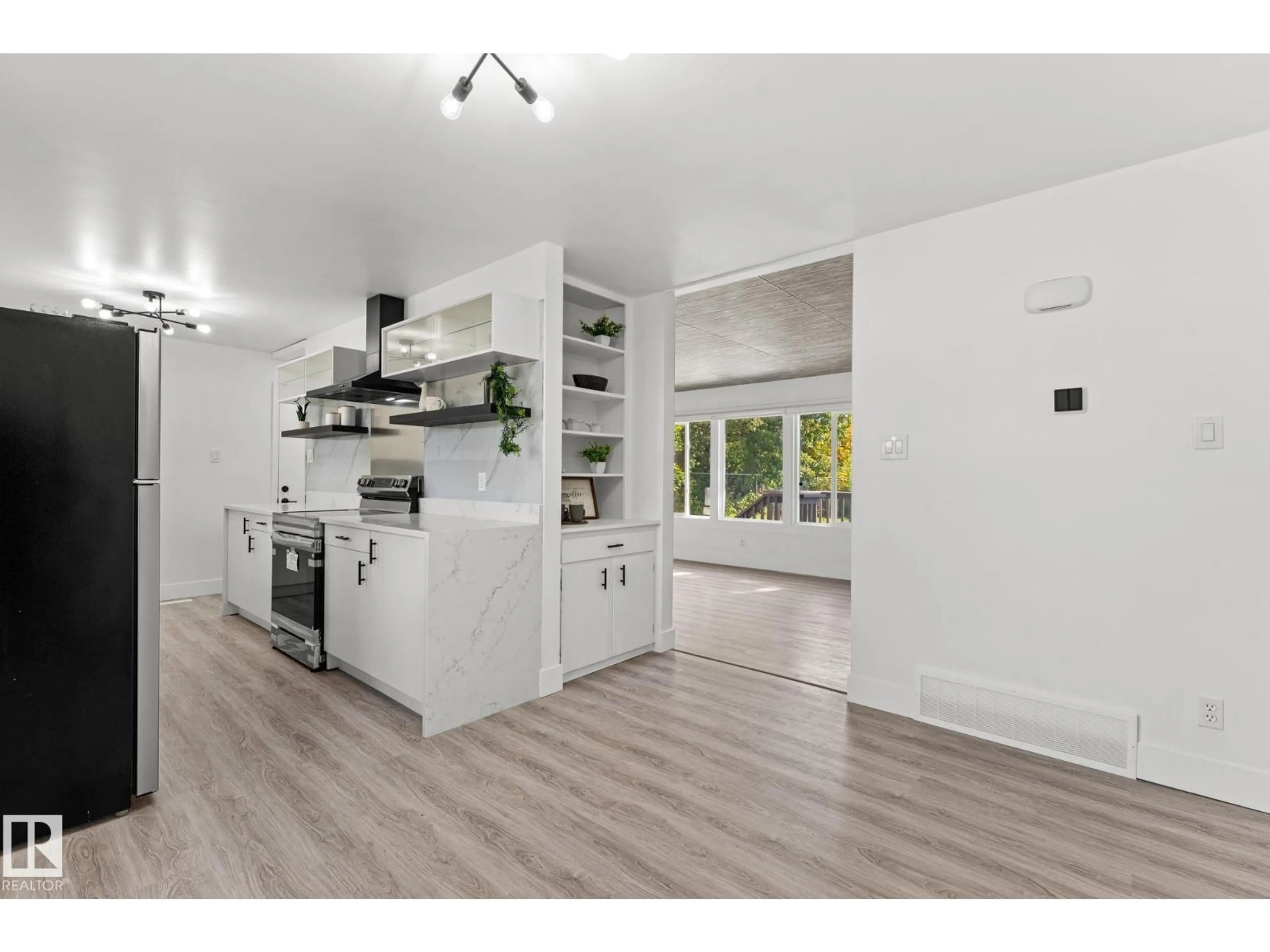 Open concept kitchen, wood/laminate floor for 970 ALDER AVE, Sherwood Park Alberta T8A1V6
