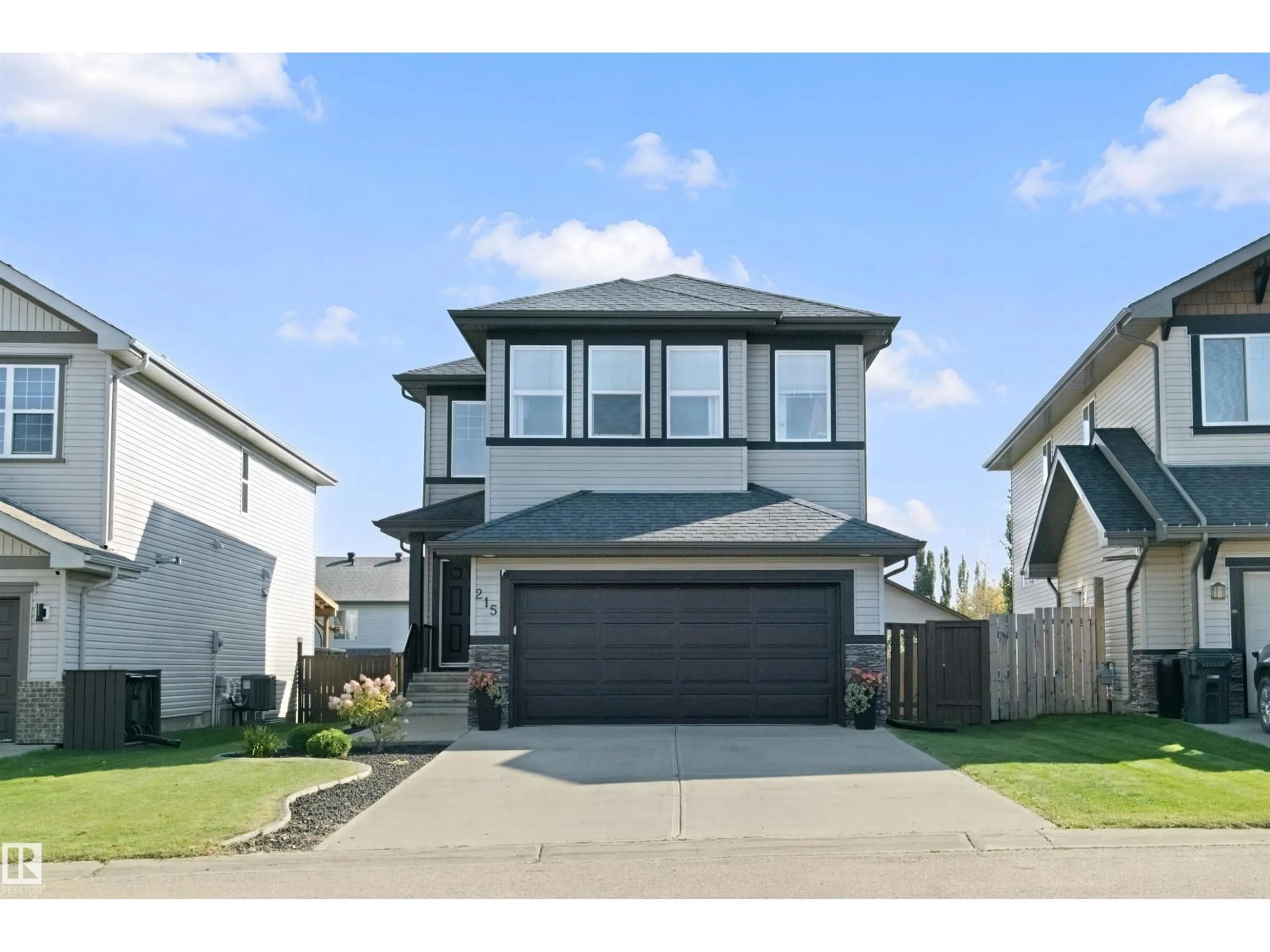 Home with vinyl exterior material, street for 215 HENDERSON LI, Spruce Grove Alberta T7X0C7