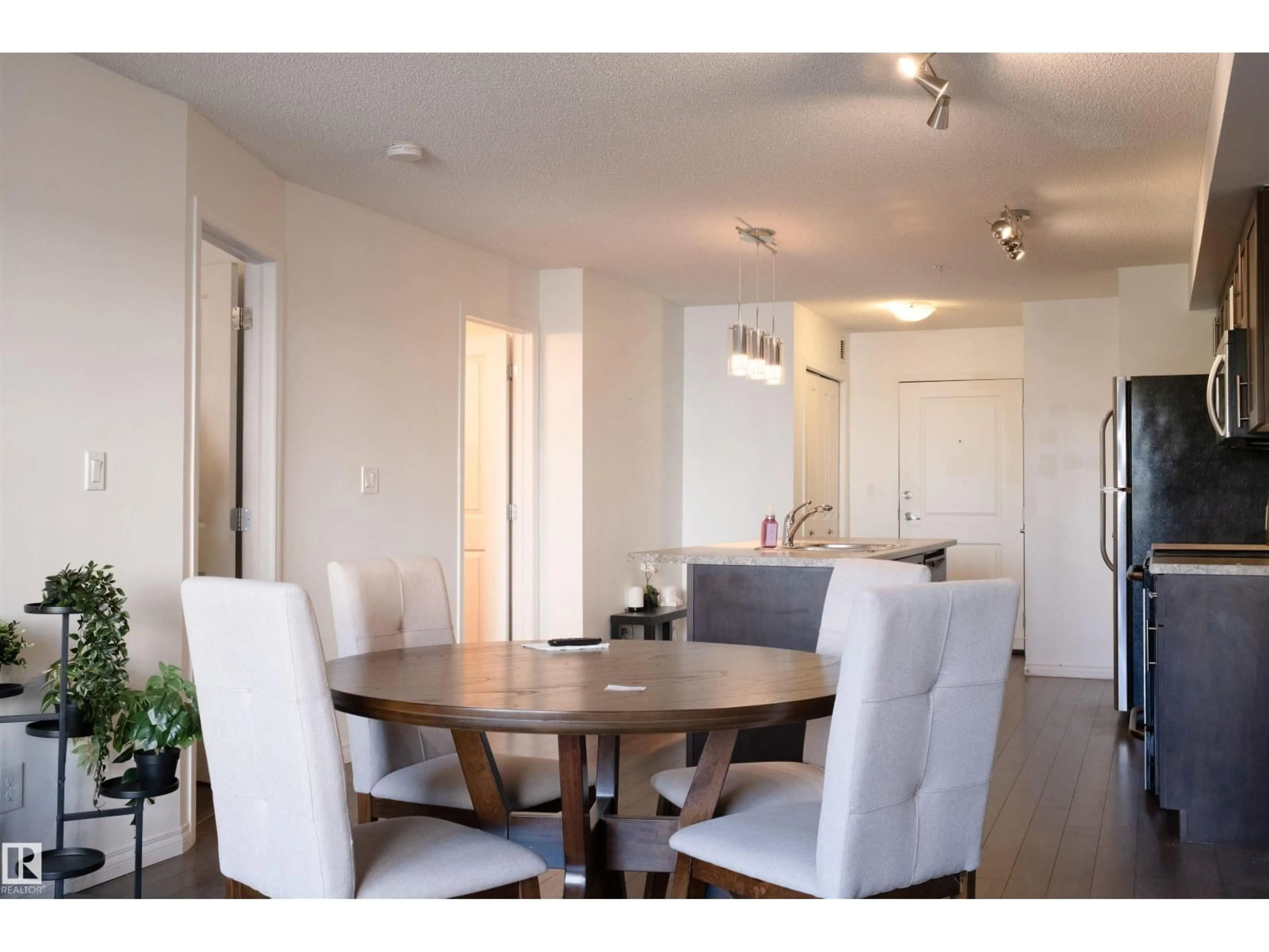 Dining room, wood/laminate floor for 111 - 206 AMBLESIDE DR, Edmonton Alberta T6W0J4