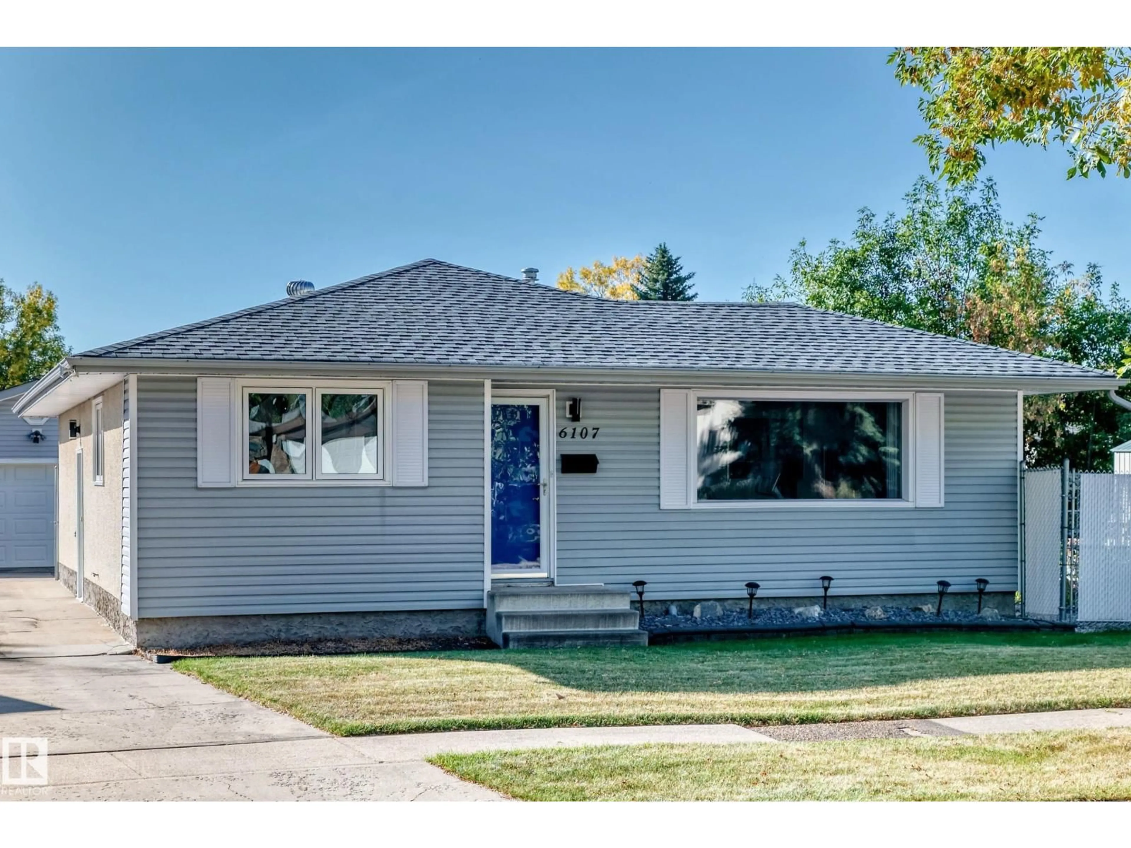 Home with vinyl exterior material, street for 6107 146 AV, Edmonton Alberta T5A1S9