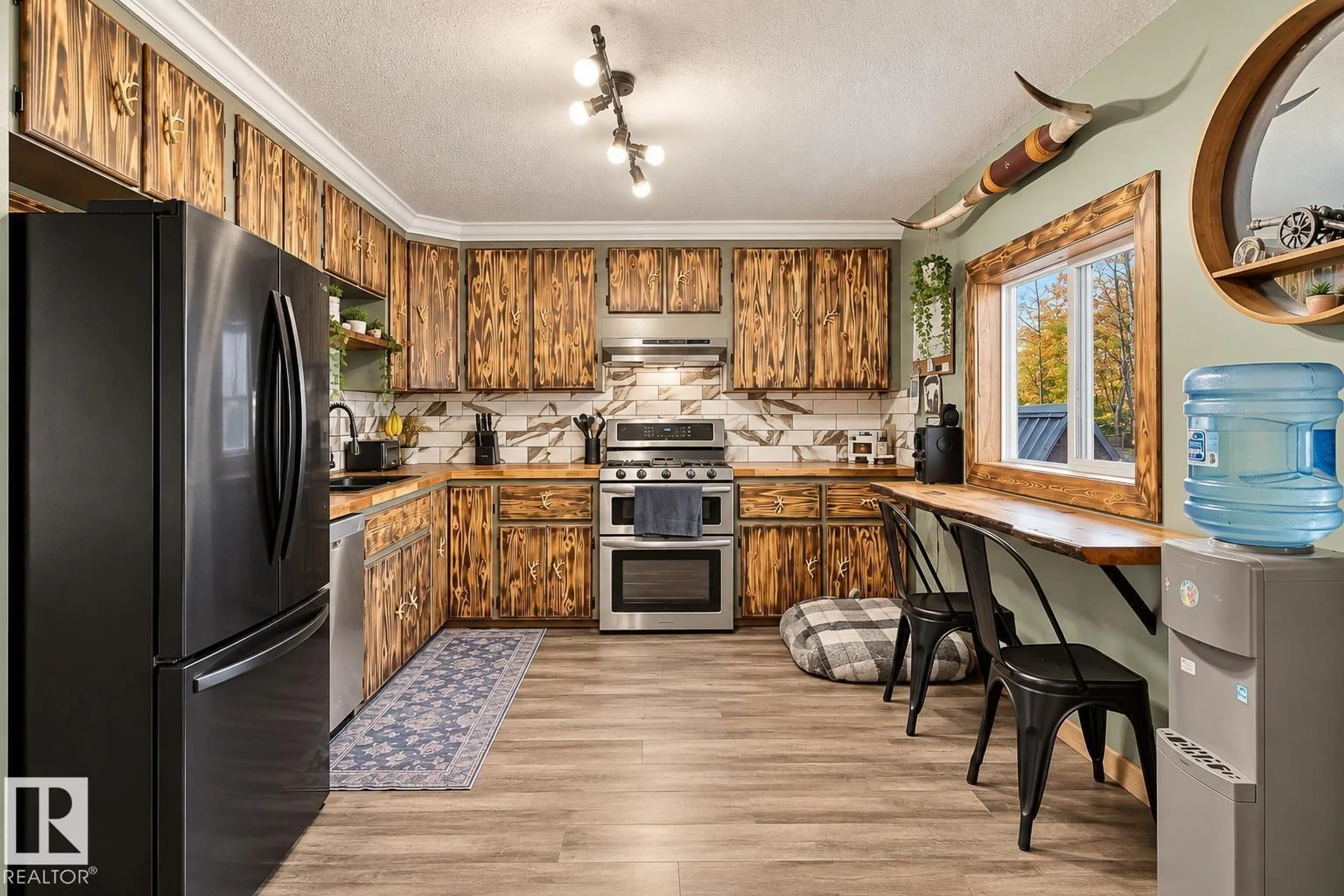 Open concept kitchen, wood/laminate floor for 62202 RR 444, Rural Bonnyville M.D. Alberta T0A1H0