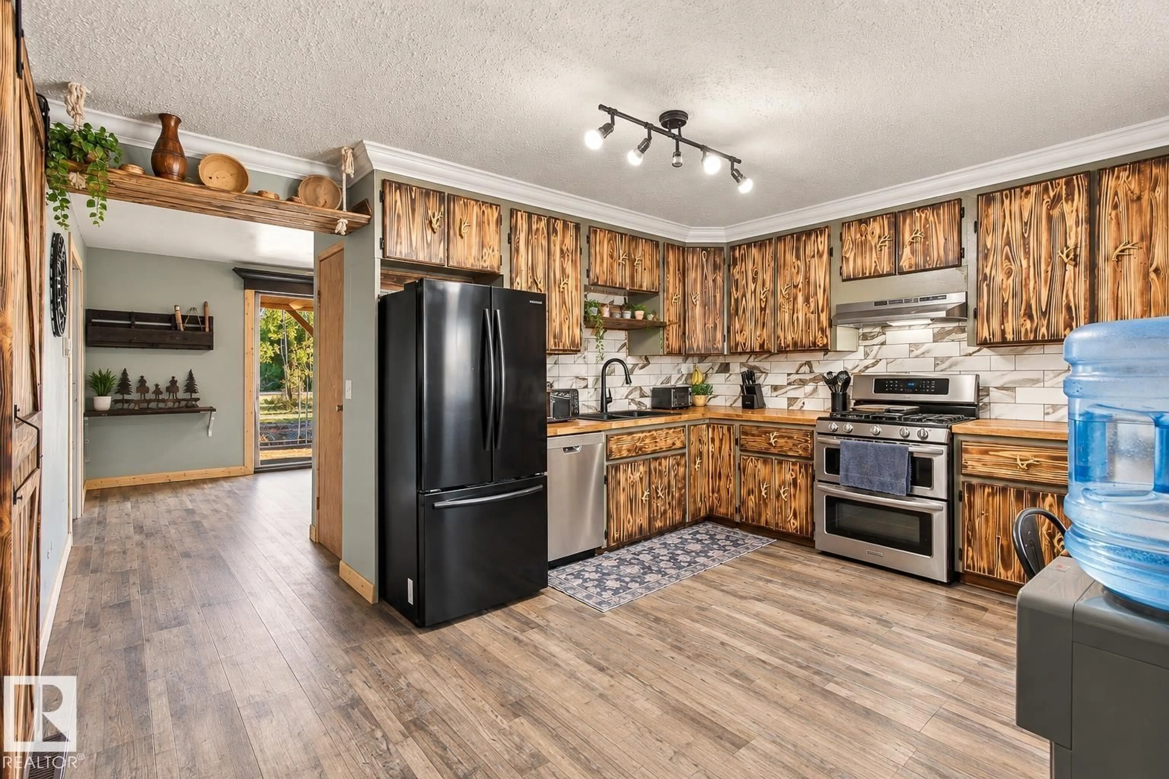 Open concept kitchen, wood/laminate floor for 62202 RR 444, Rural Bonnyville M.D. Alberta T0A1H0