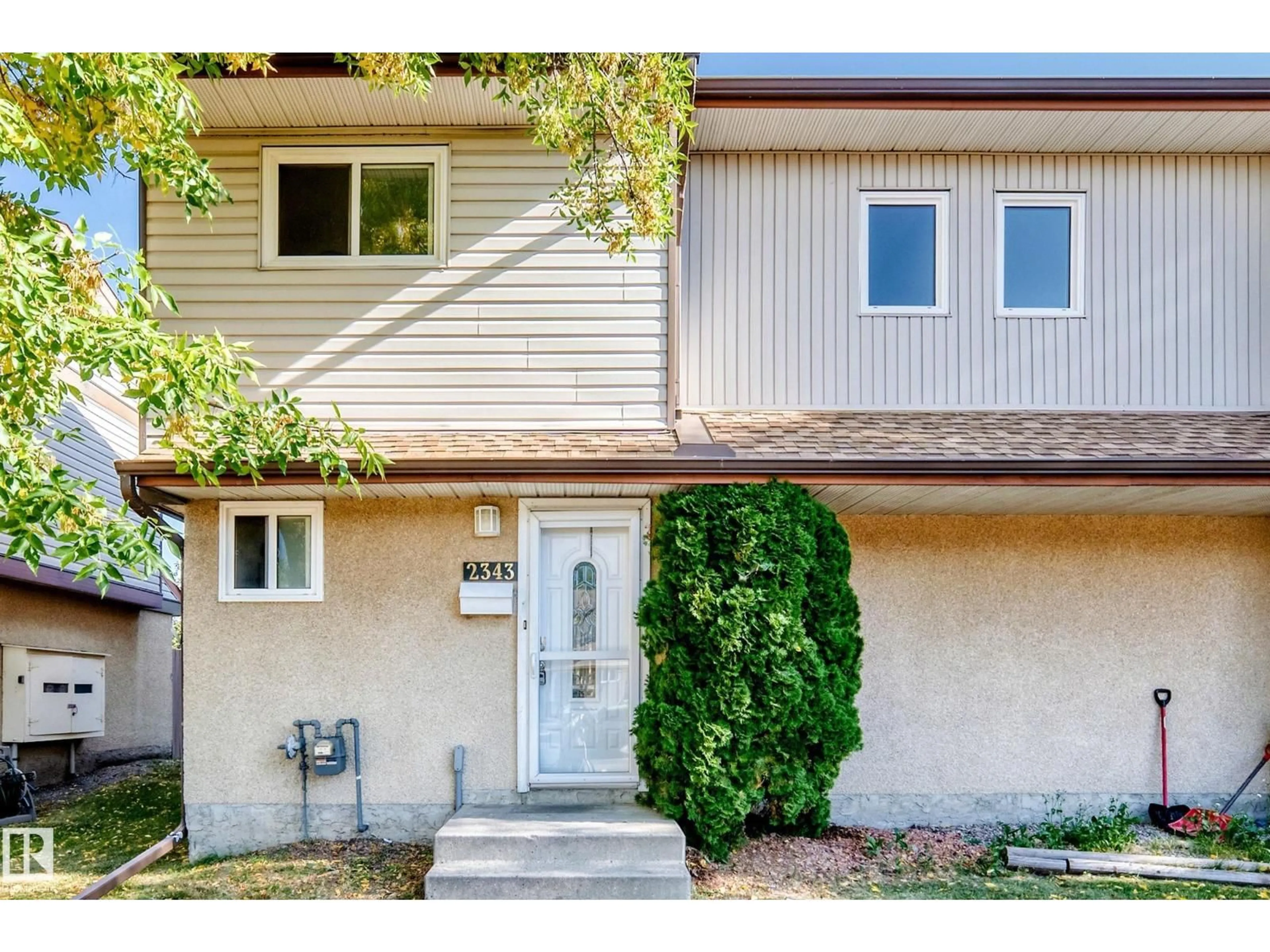 Home with vinyl exterior material, street for 2343 139 AV, Edmonton Alberta T5Y1S1