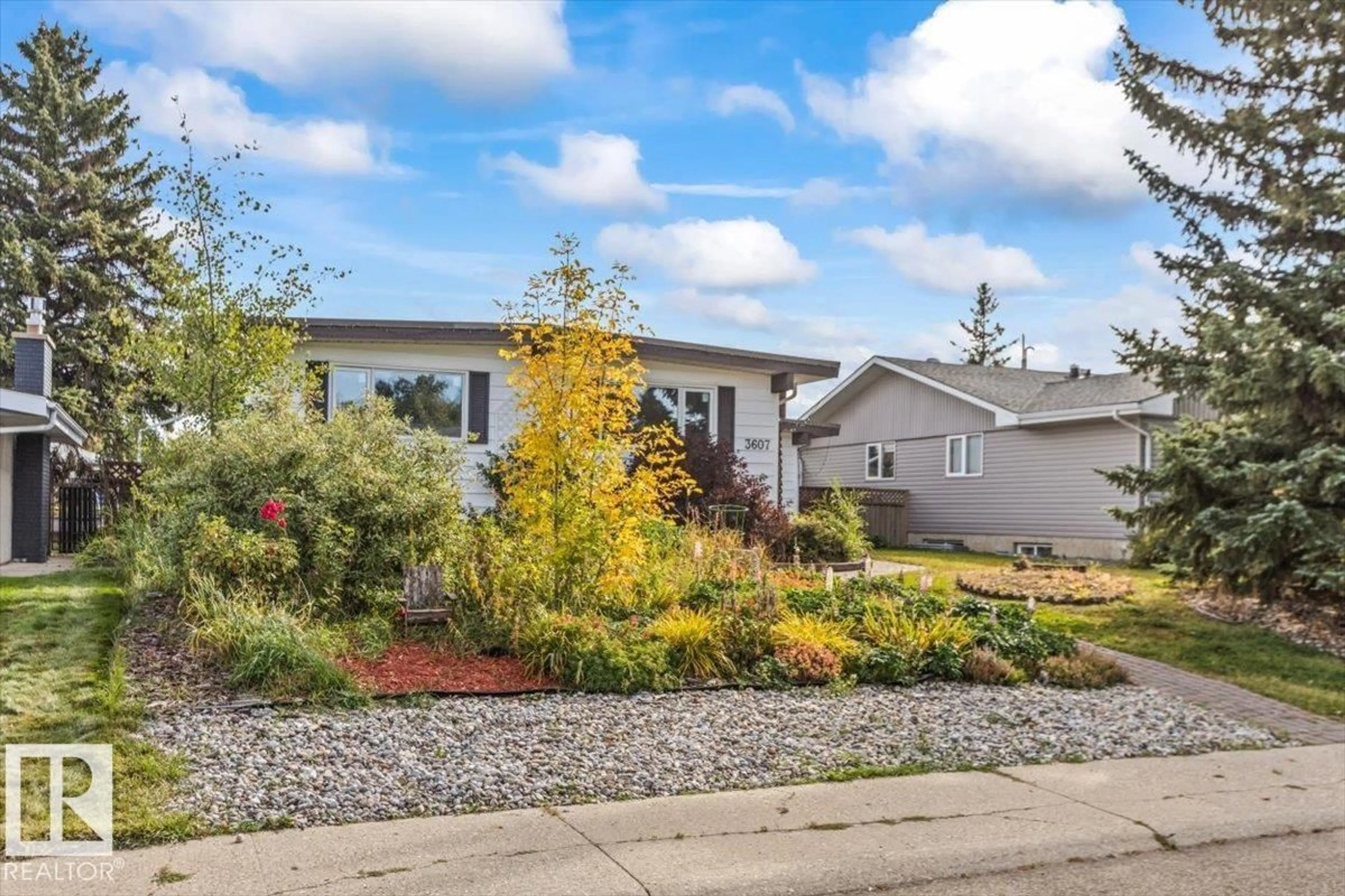 Home with vinyl exterior material, street for NW - 3607 106A ST, Edmonton Alberta T6J1A7