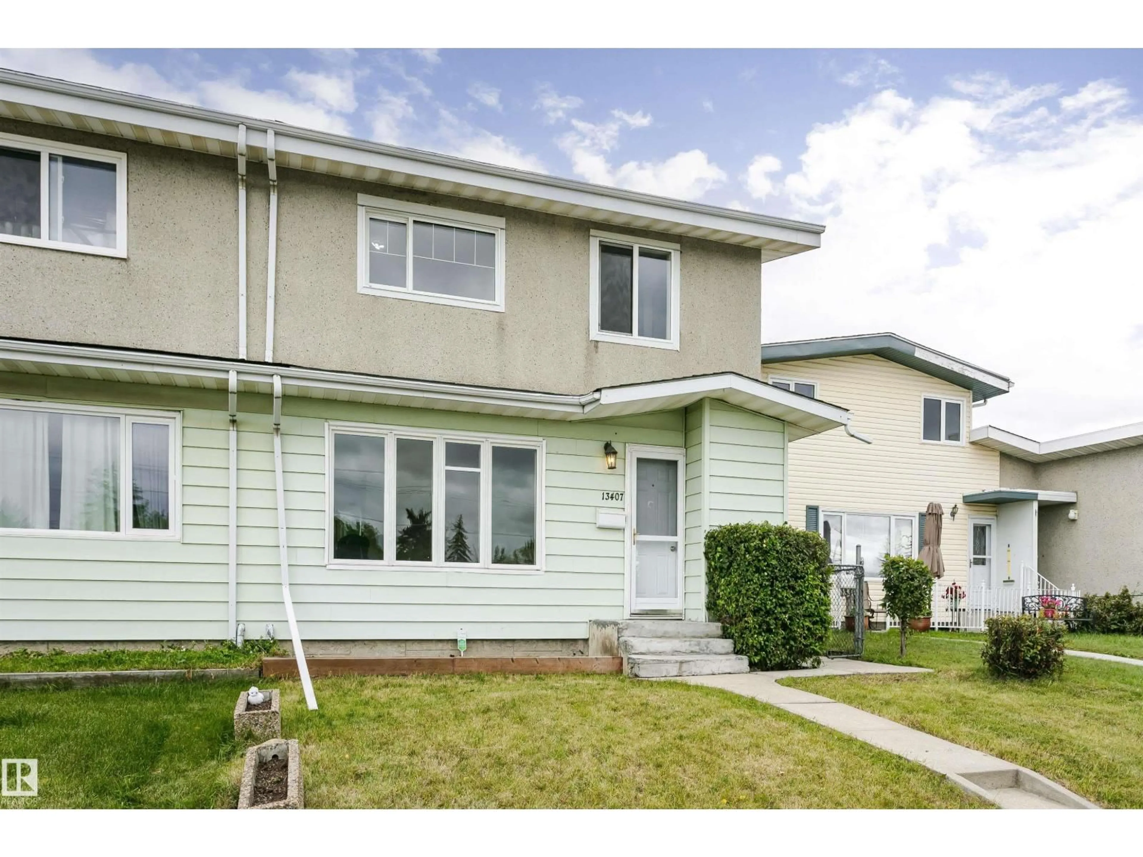 Home with vinyl exterior material, street for NW - 13407 82 ST, Edmonton Alberta T5E2T9