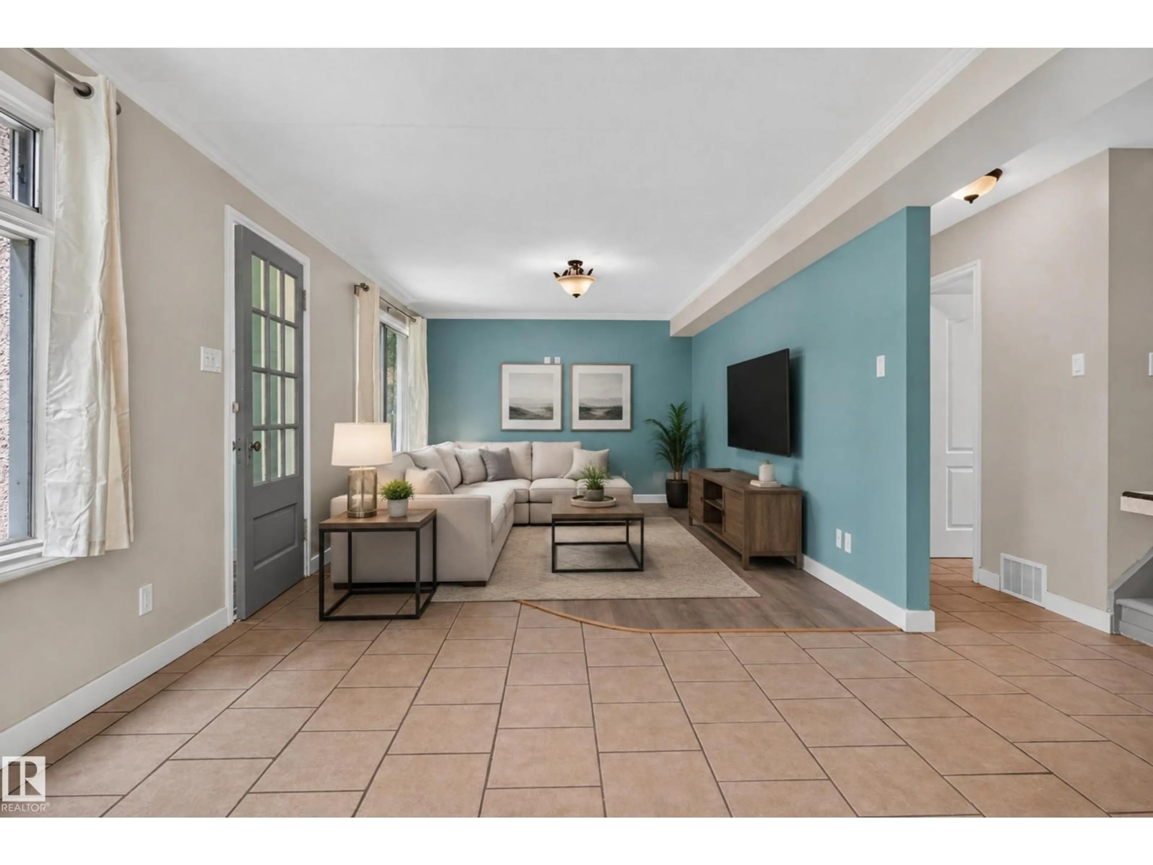 Living room with furniture, ceramic/tile floor for 11549 88 ST, Edmonton Alberta T5B3R2