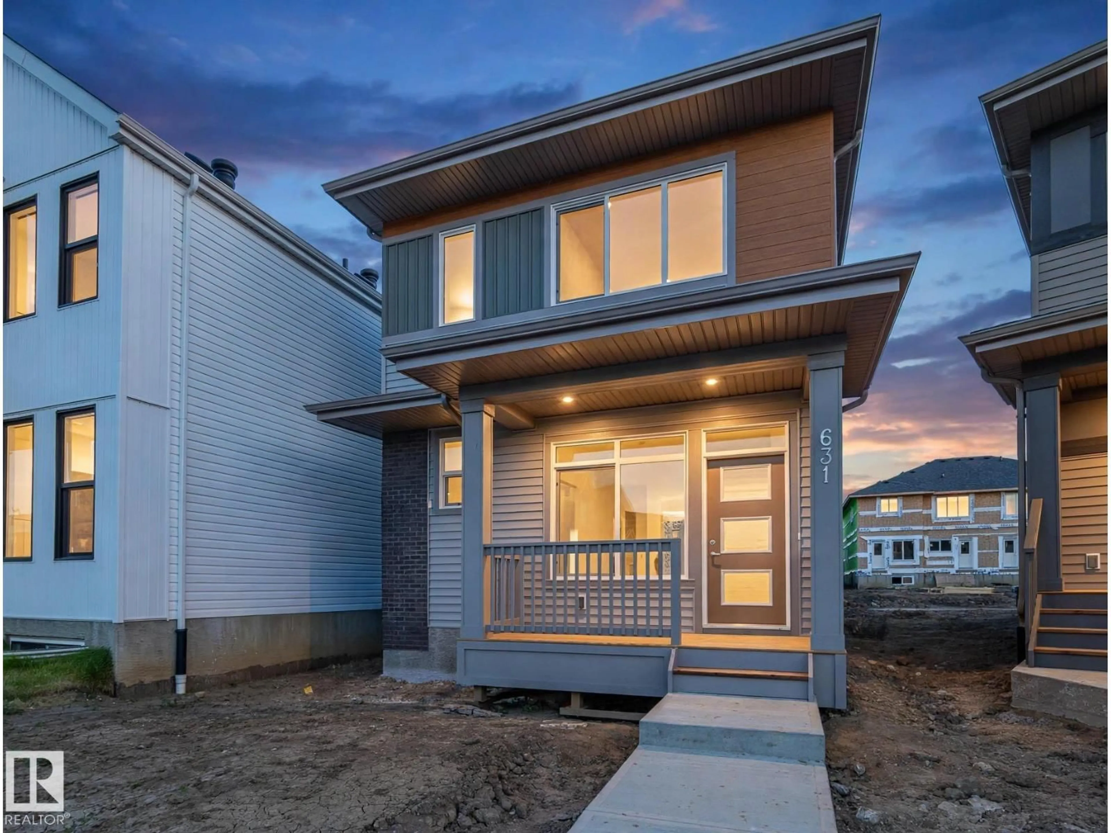 Home with vinyl exterior material, street for NE - 631 173 AV, Edmonton Alberta T5Y4E8