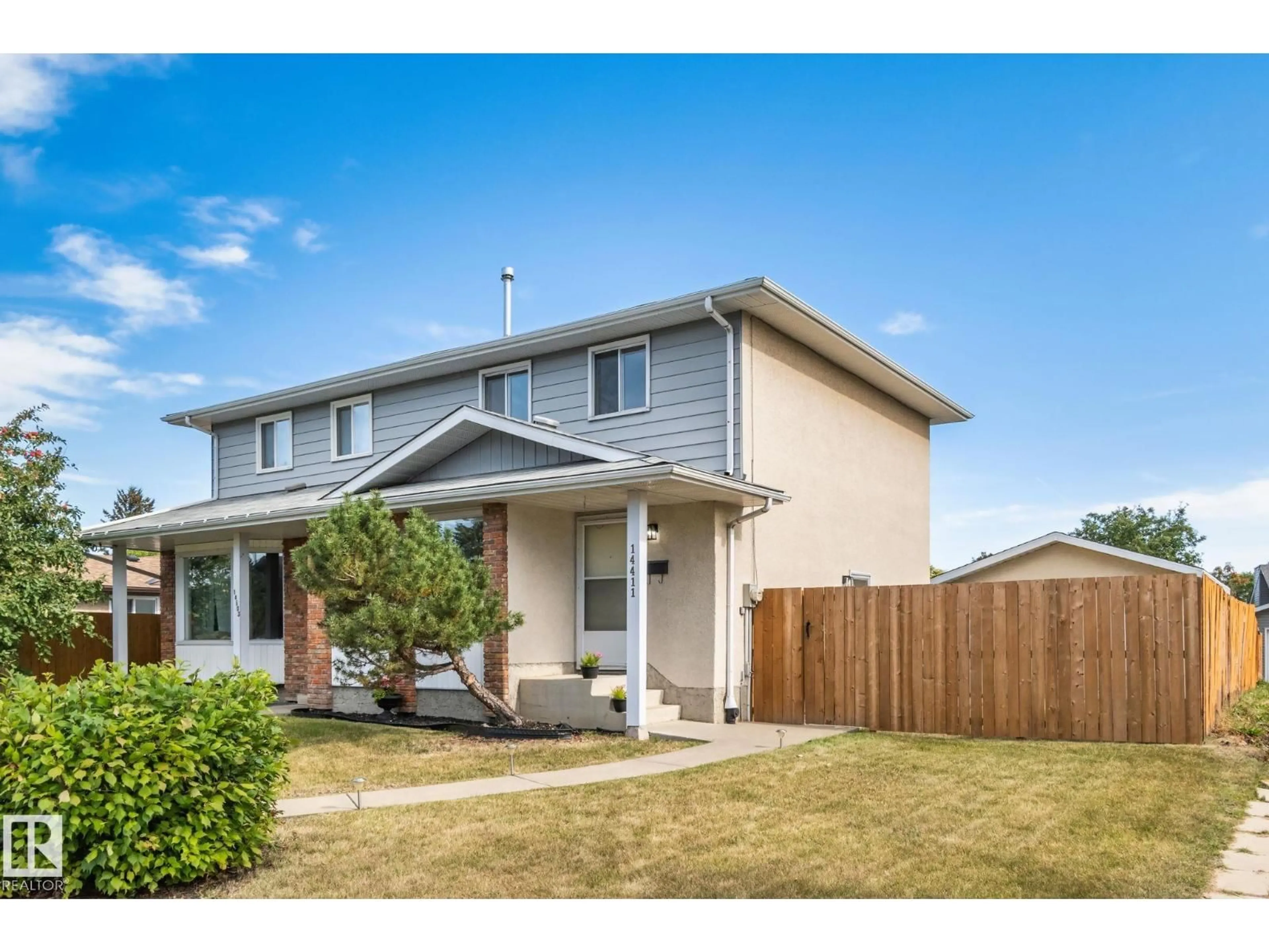Home with vinyl exterior material, street for NW - 14411 23 ST, Edmonton Alberta T5Y1T4