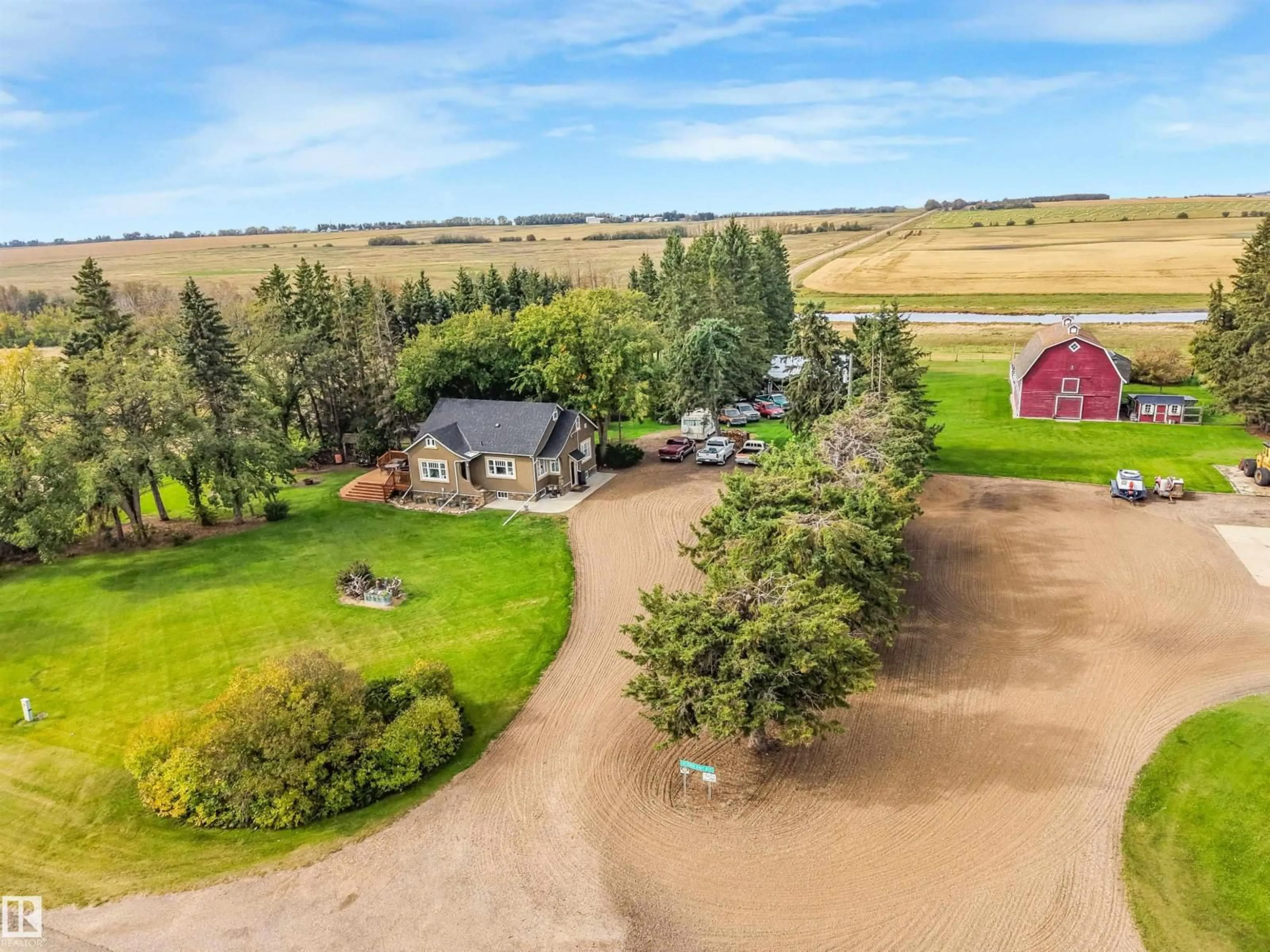 A pic from outside/outdoor area/front of a property/back of a property/a pic from drone, water/lake/river/ocean view for 572004 - 857 HI, Rural Two Hills County Alberta T0B4R0