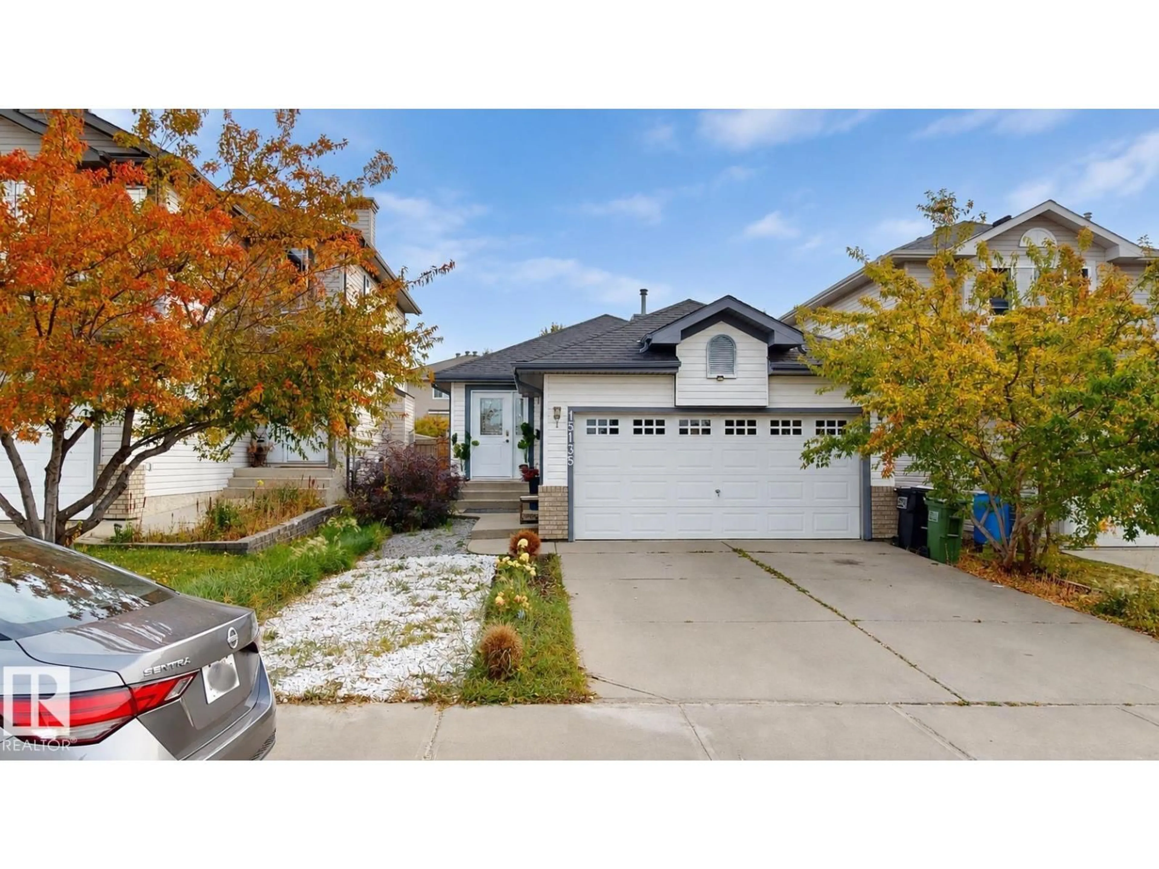 Home with vinyl exterior material, street for NW - 15135 43 ST, Edmonton Alberta T5Y3B3