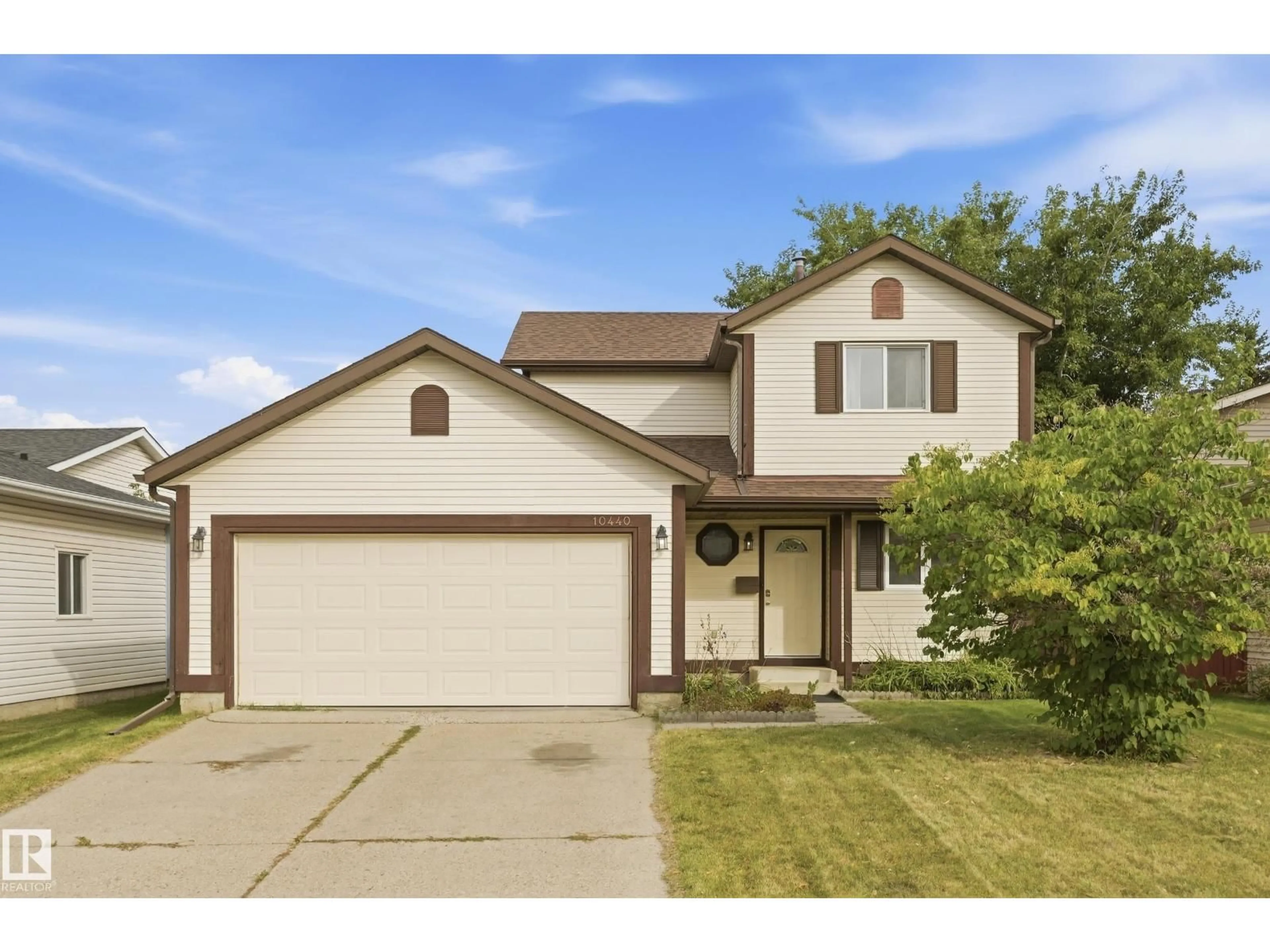 Home with vinyl exterior material, street for NW - 10440 16 AVENUE, Edmonton Alberta T6J5N8