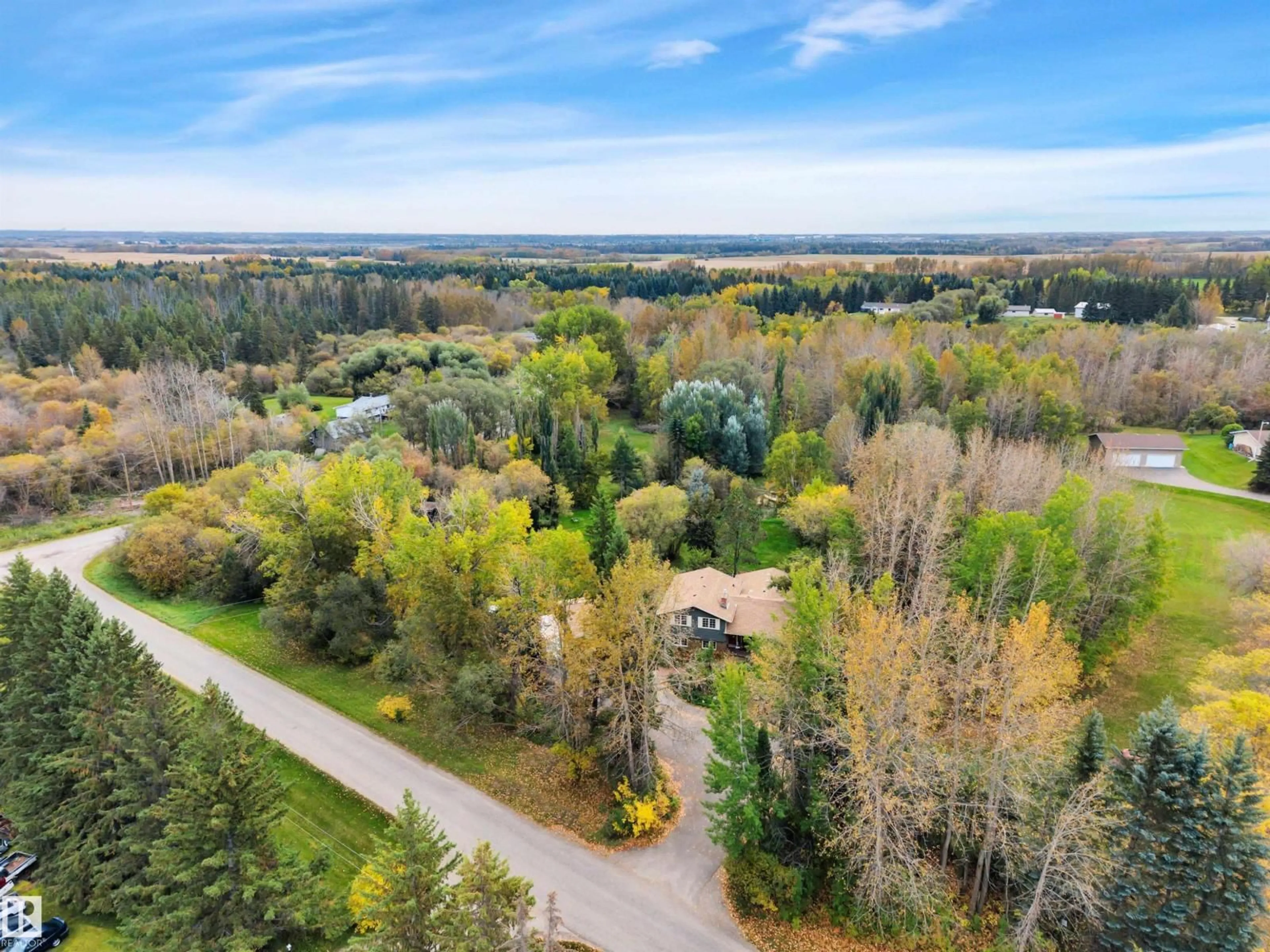 A pic from outside/outdoor area/front of a property/back of a property/a pic from drone, forest/trees view for 53313 - 217 RGE ROAD 280, Rural Parkland County Alberta T7X3V7