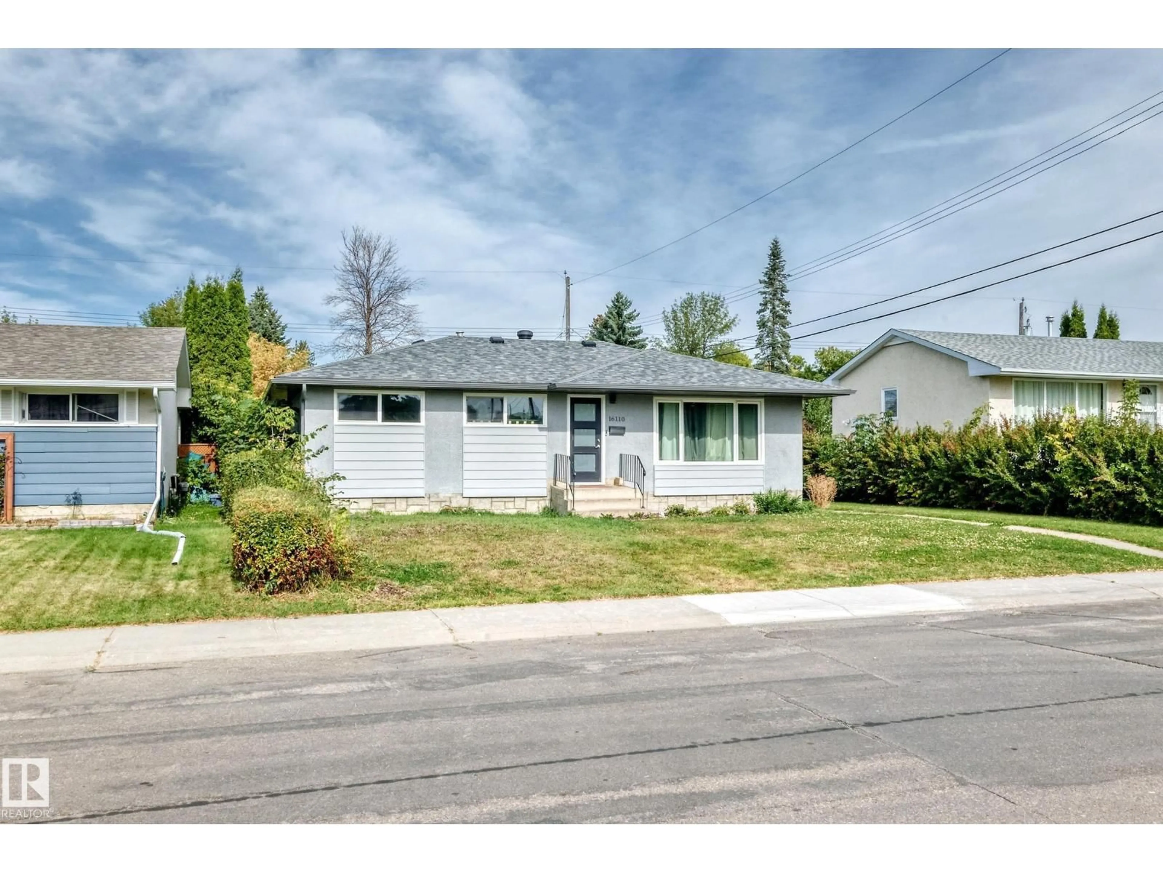 Home with vinyl exterior material, street for 16110 82 AV, Edmonton Alberta T5R3S4