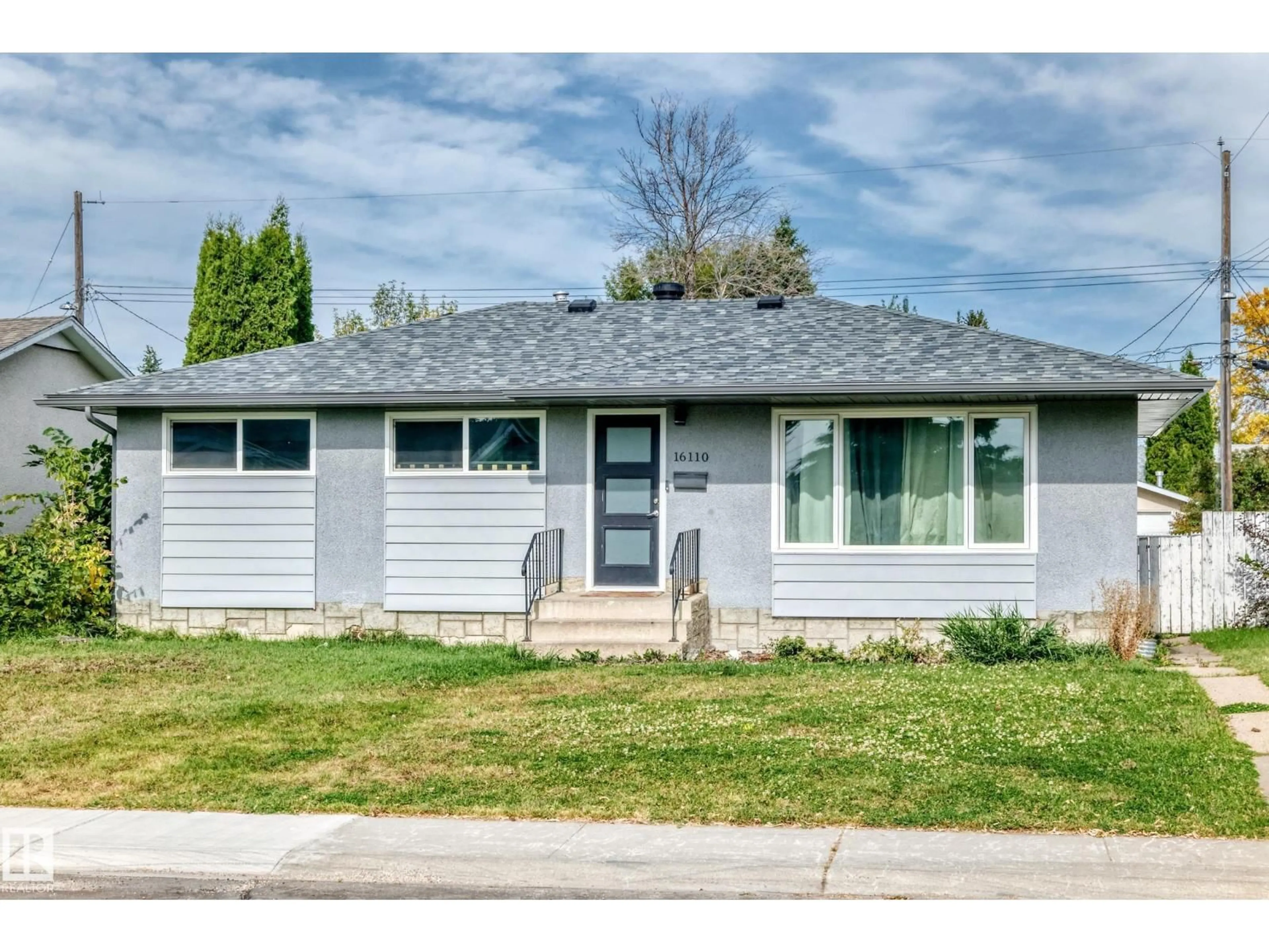 Home with vinyl exterior material, street for 16110 82 AV, Edmonton Alberta T5R3S4