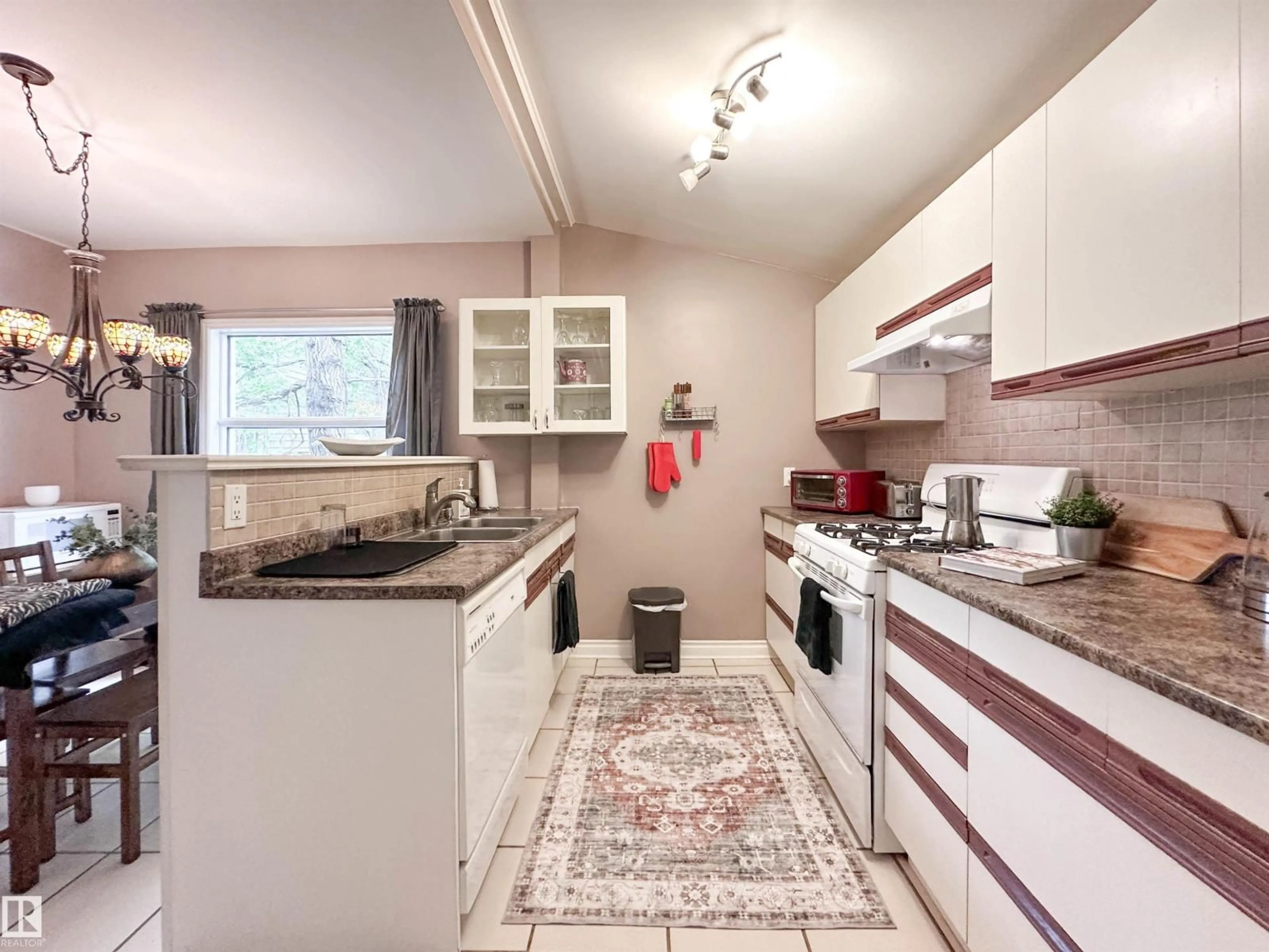 Open concept kitchen, ceramic/tile floor for 11825 80 ST, Edmonton Alberta T5B2N6
