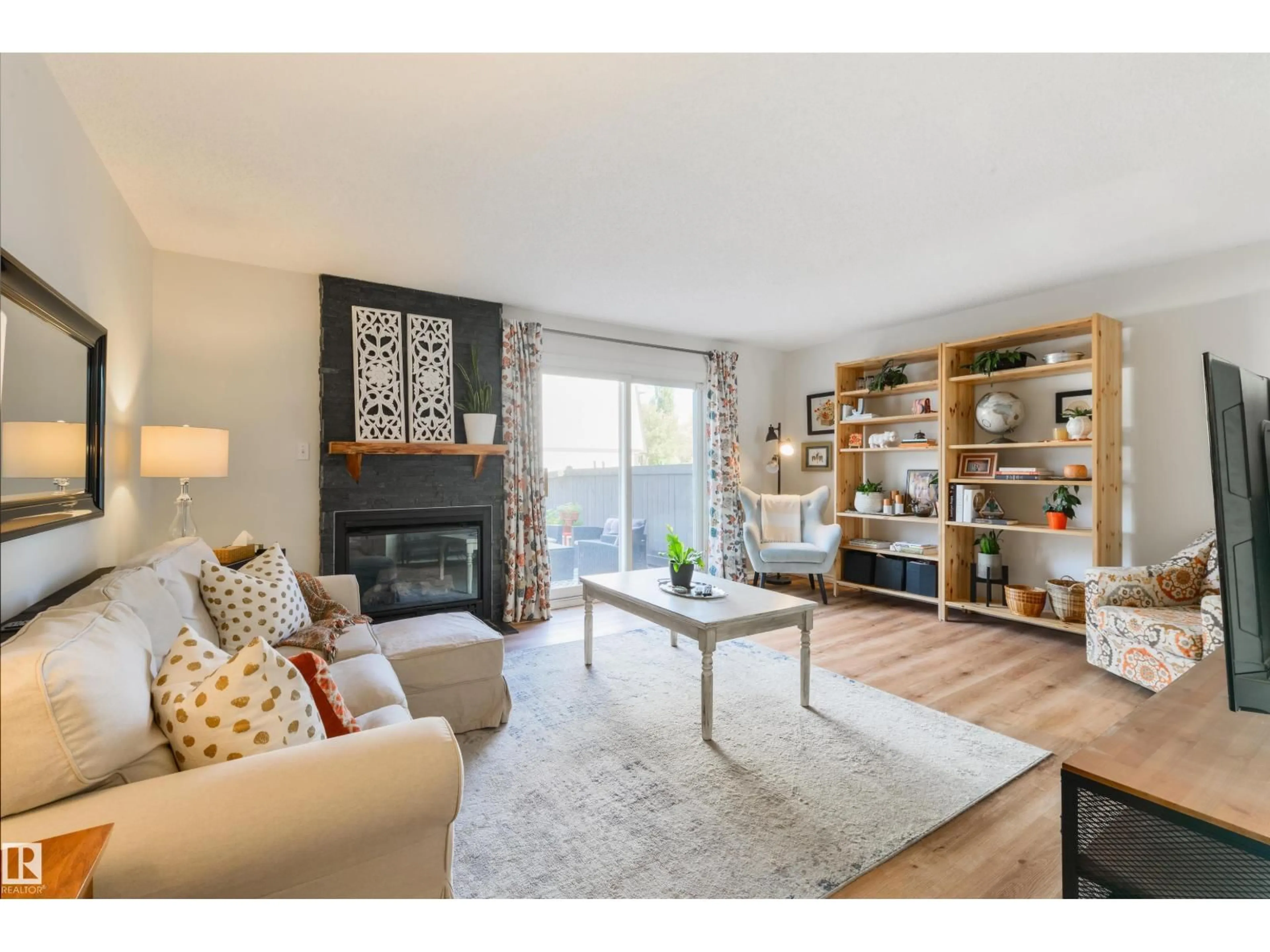 Living room with furniture, wood/laminate floor for 177 TUDOR LN, Edmonton Alberta T6J3T5