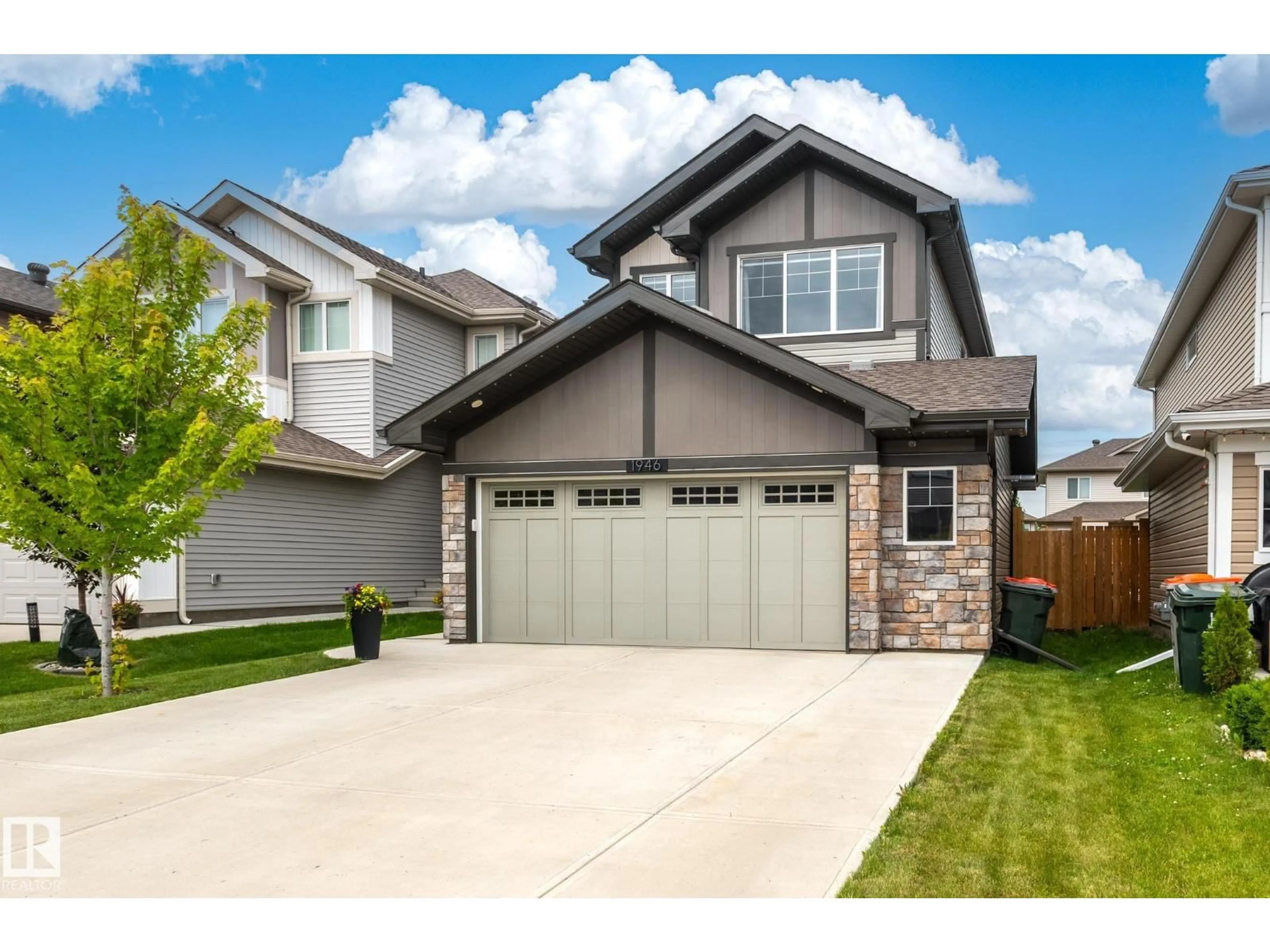 Home with vinyl exterior material, street for 1946 WESTERRA LN, Stony Plain Alberta T7Z0M9
