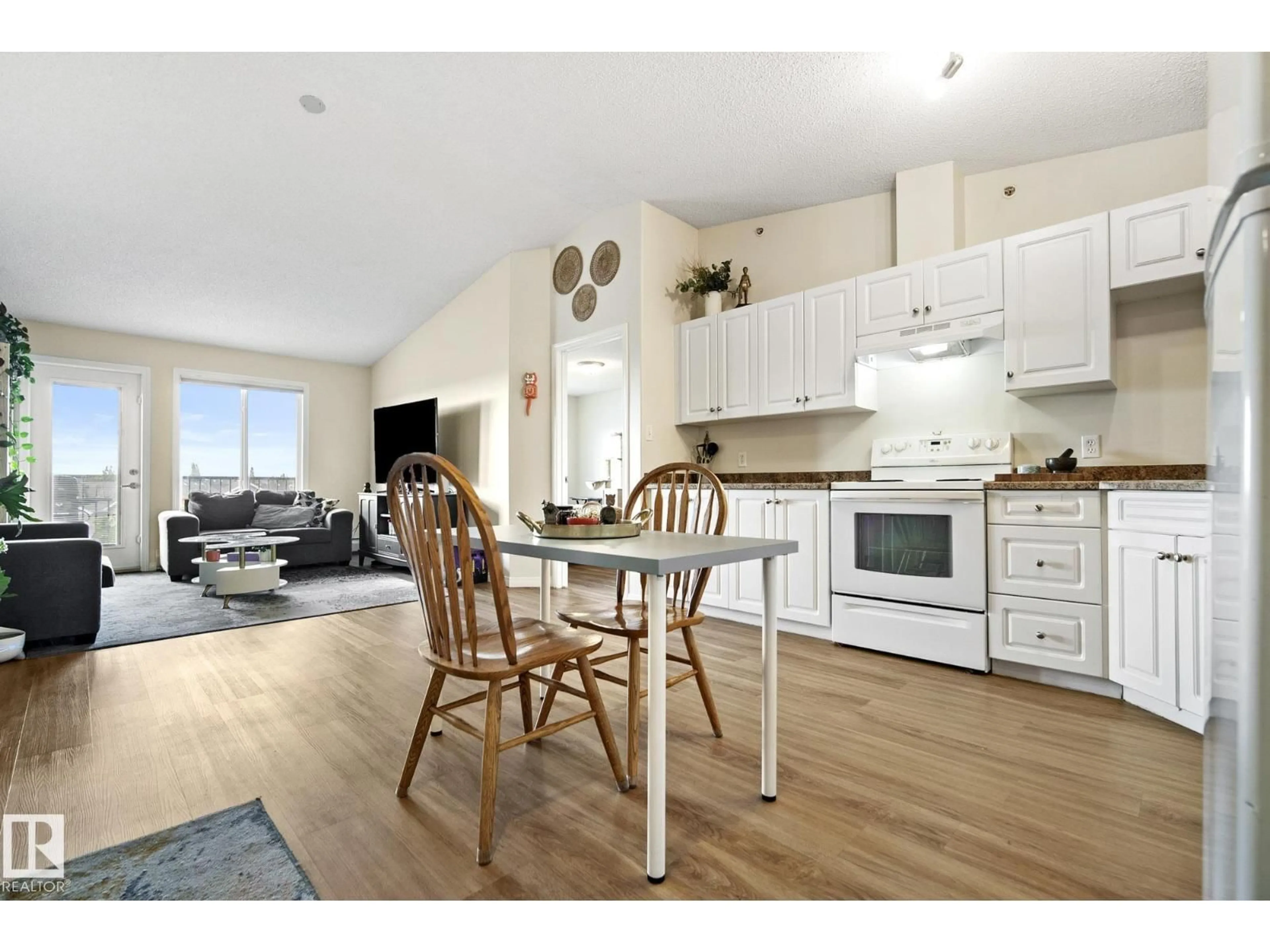 Open concept kitchen, wood/laminate floor for 111 - 416 EDWARDS DR, Edmonton Alberta T6X0C4