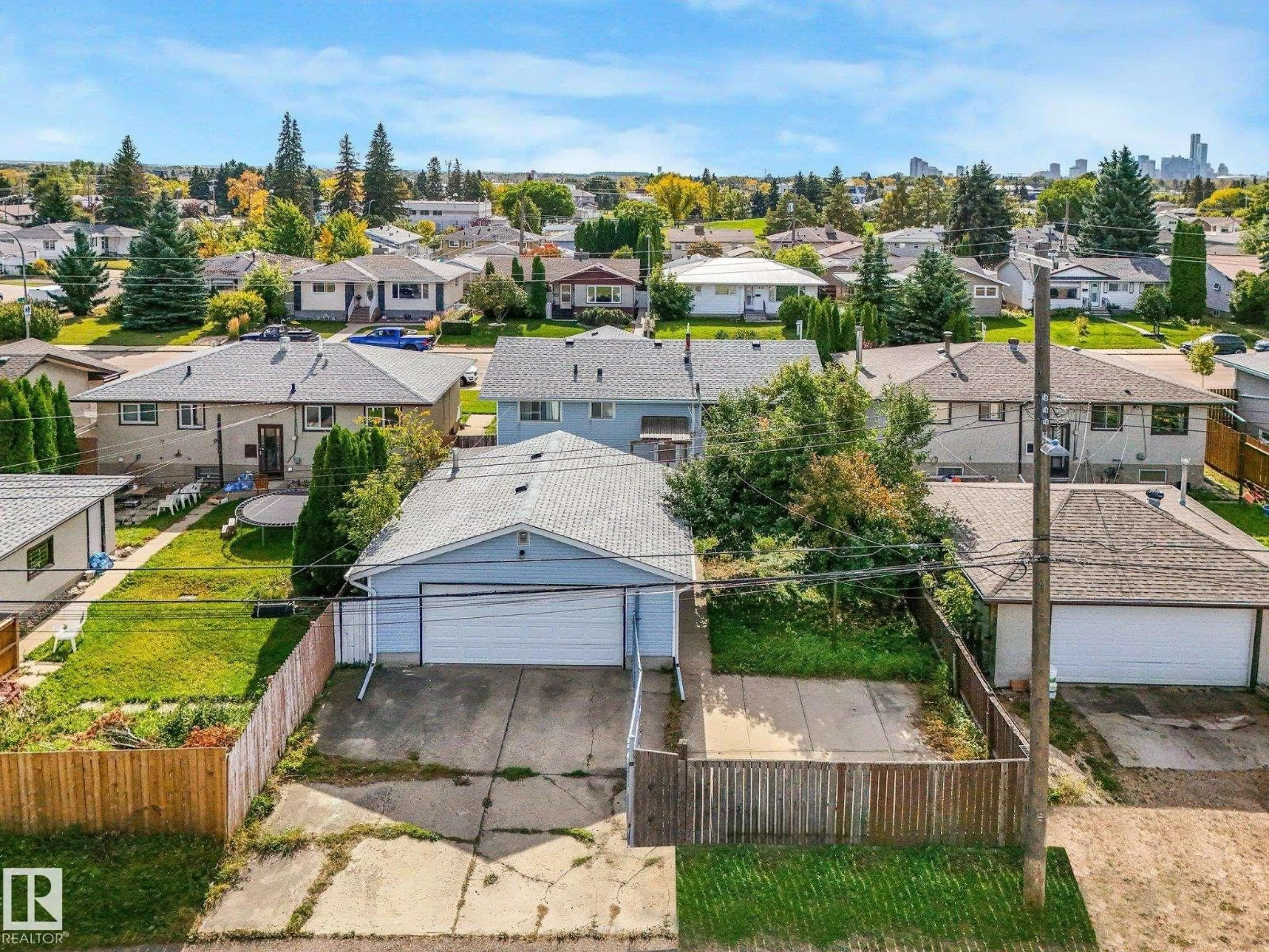 A pic from outside/outdoor area/front of a property/back of a property/a pic from drone, street for 7520 130 AV, Edmonton Alberta T5C1Y2