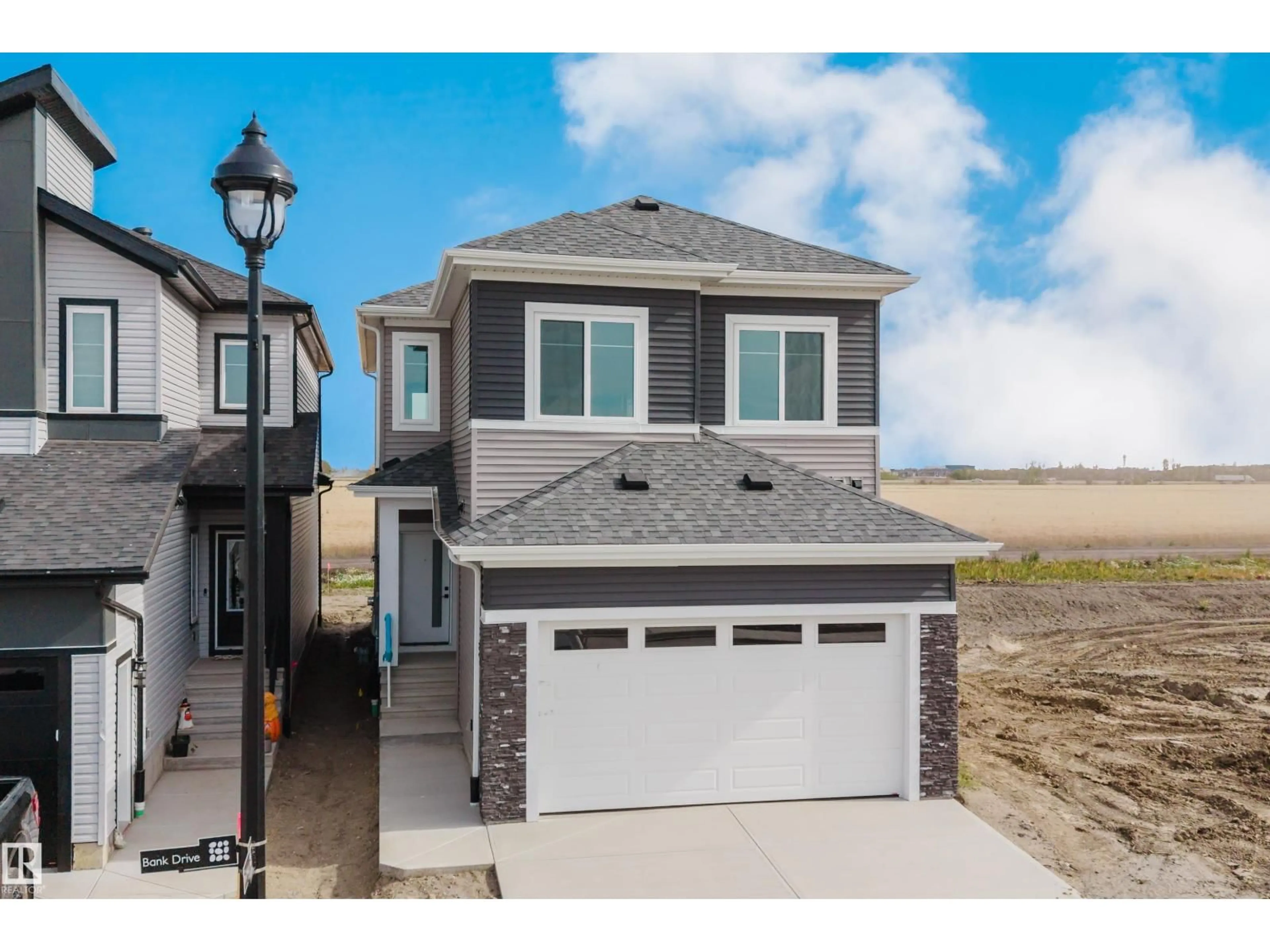 Home with vinyl exterior material, street for 780 BANK DR, Leduc Alberta T9E1G2