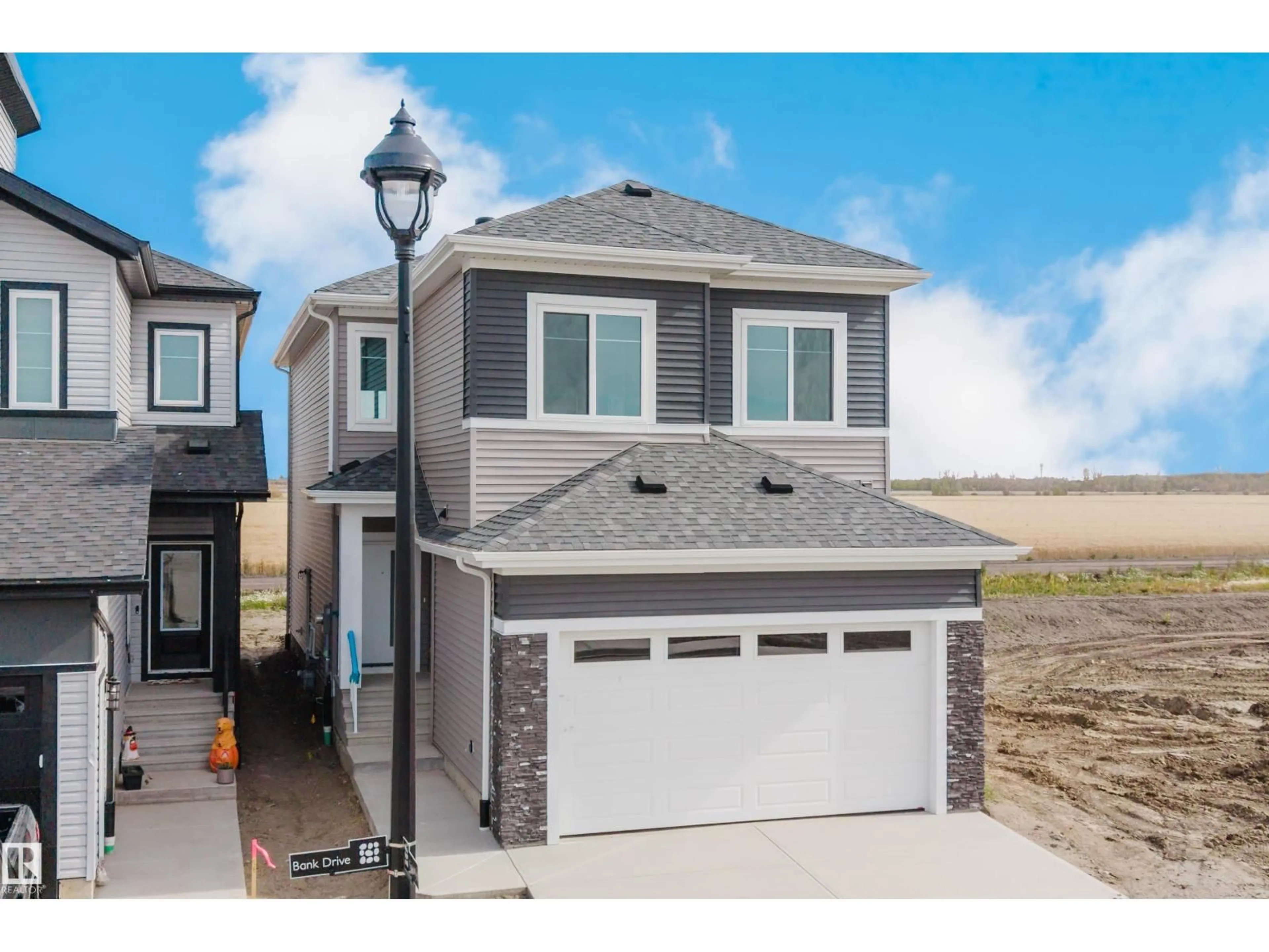 Home with vinyl exterior material, street for 780 BANK DR, Leduc Alberta T9E1G2