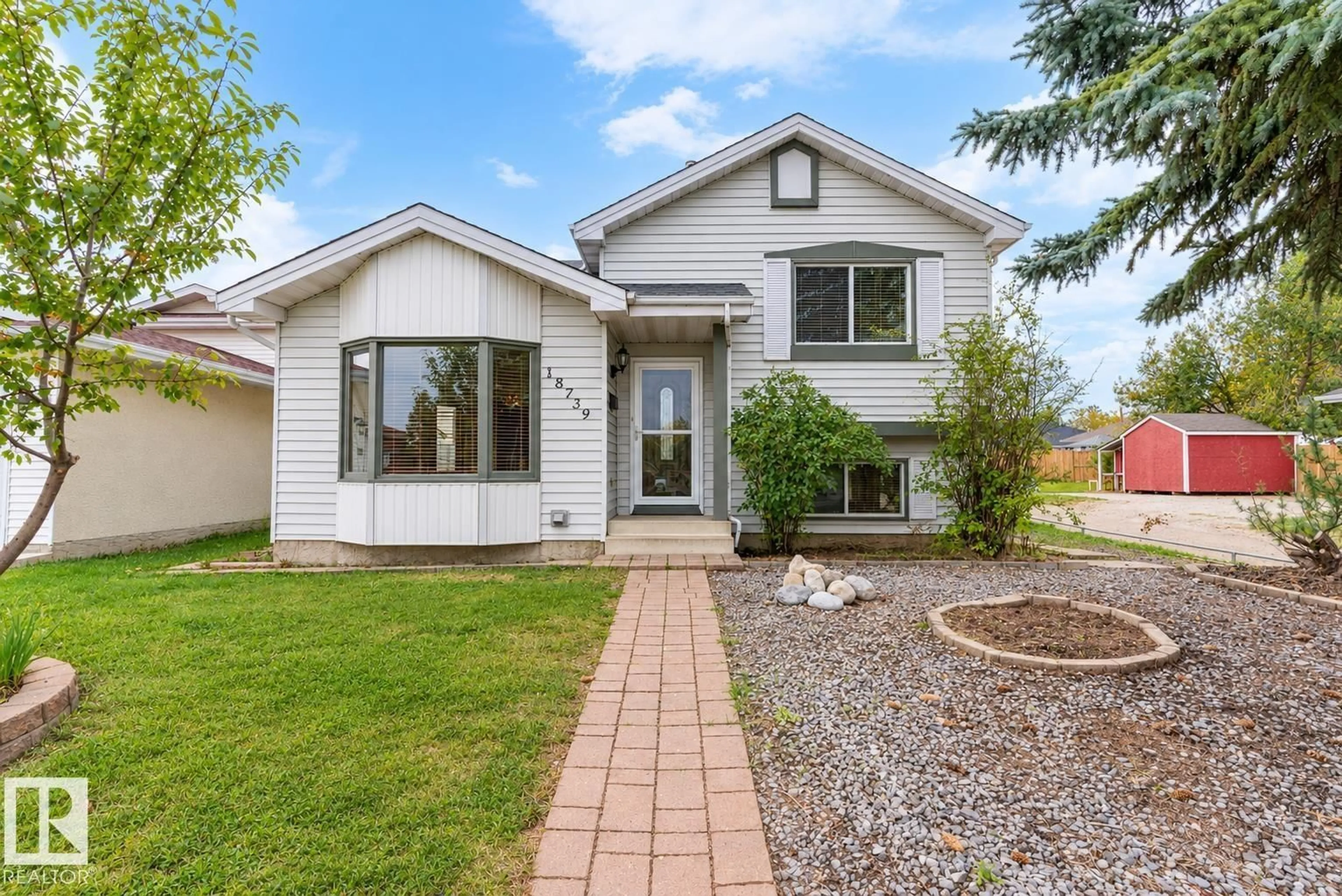 Home with vinyl exterior material, street for 18739 72 AV, Edmonton Alberta T5T5E7
