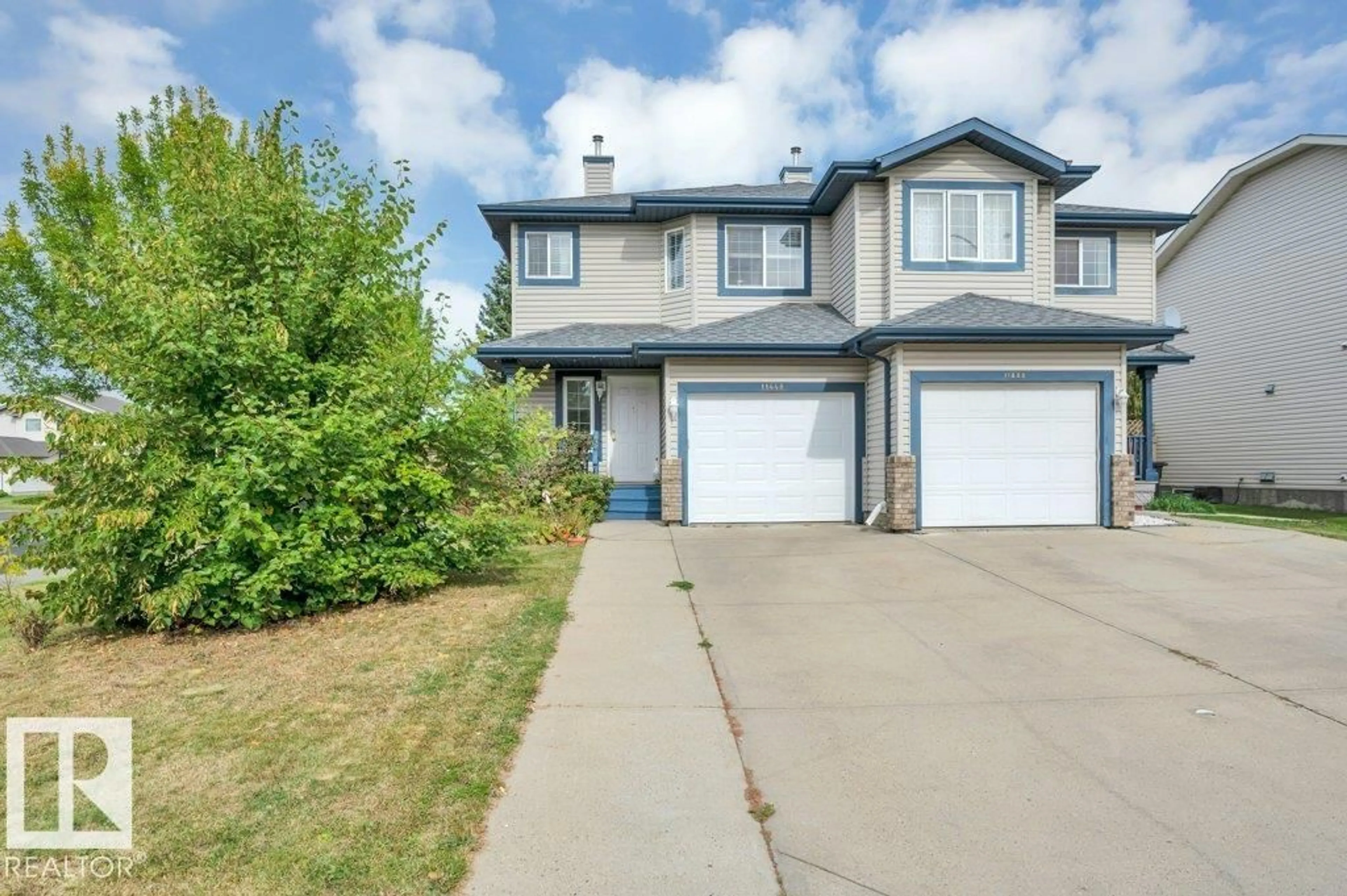 Home with vinyl exterior material, street for NW - 11448 169 AV, Edmonton Alberta T5X6G7