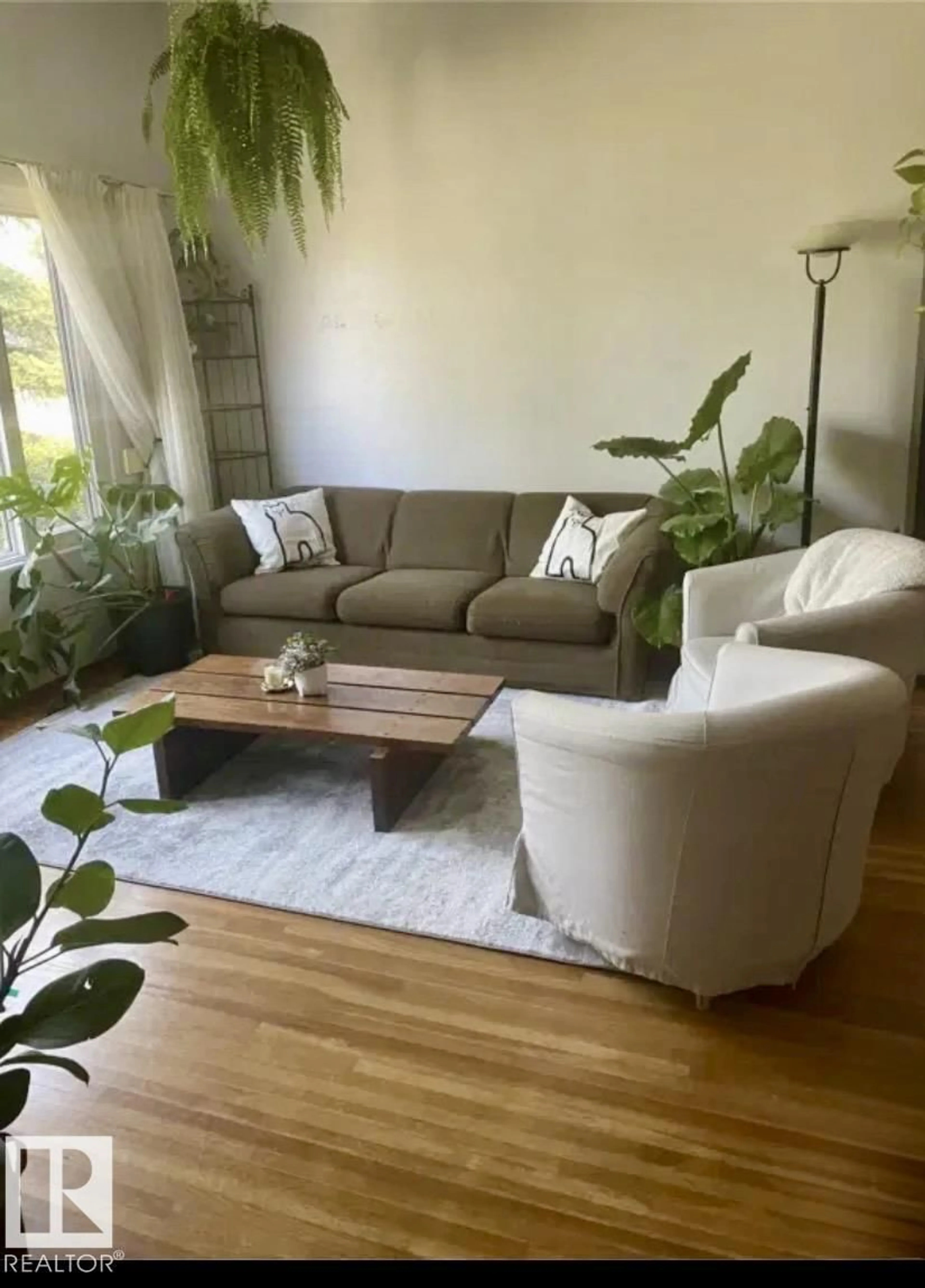 Living room with furniture, wood/laminate floor for 6109 90 AV, Edmonton Alberta T6B0P1