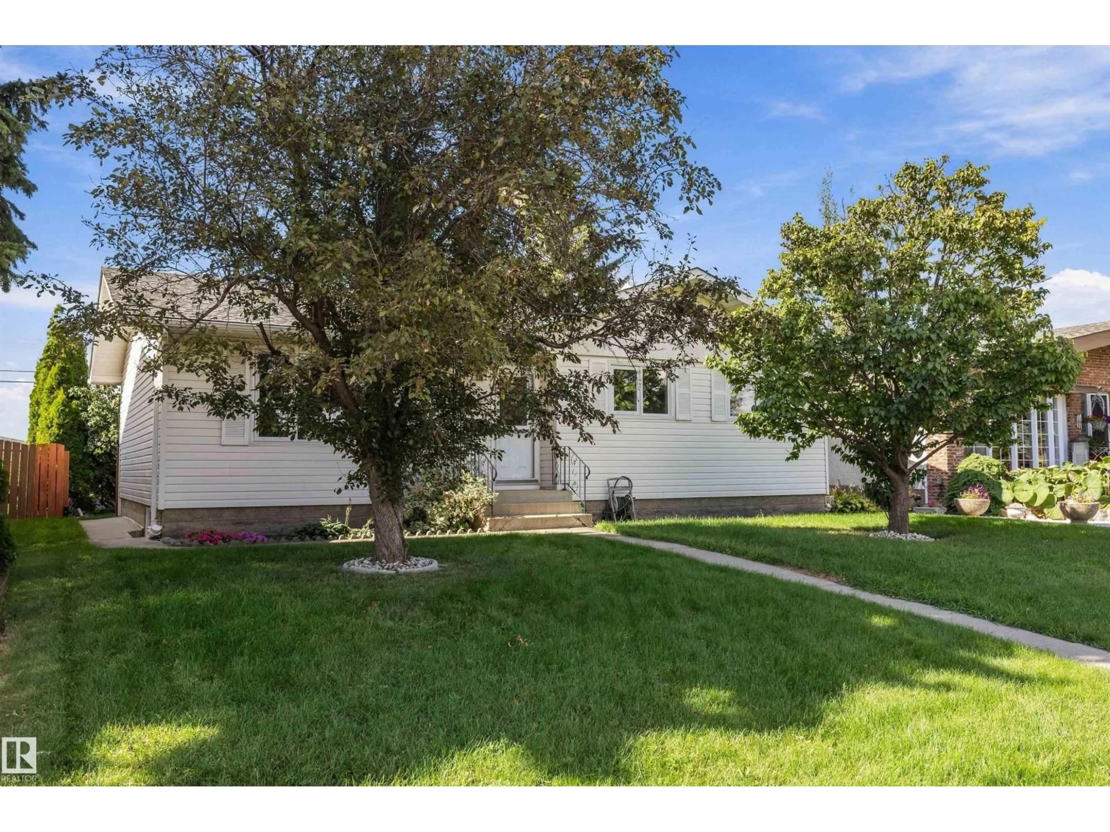 Home with vinyl exterior material, street for 13304 73 ST, Edmonton Alberta T5C0T8