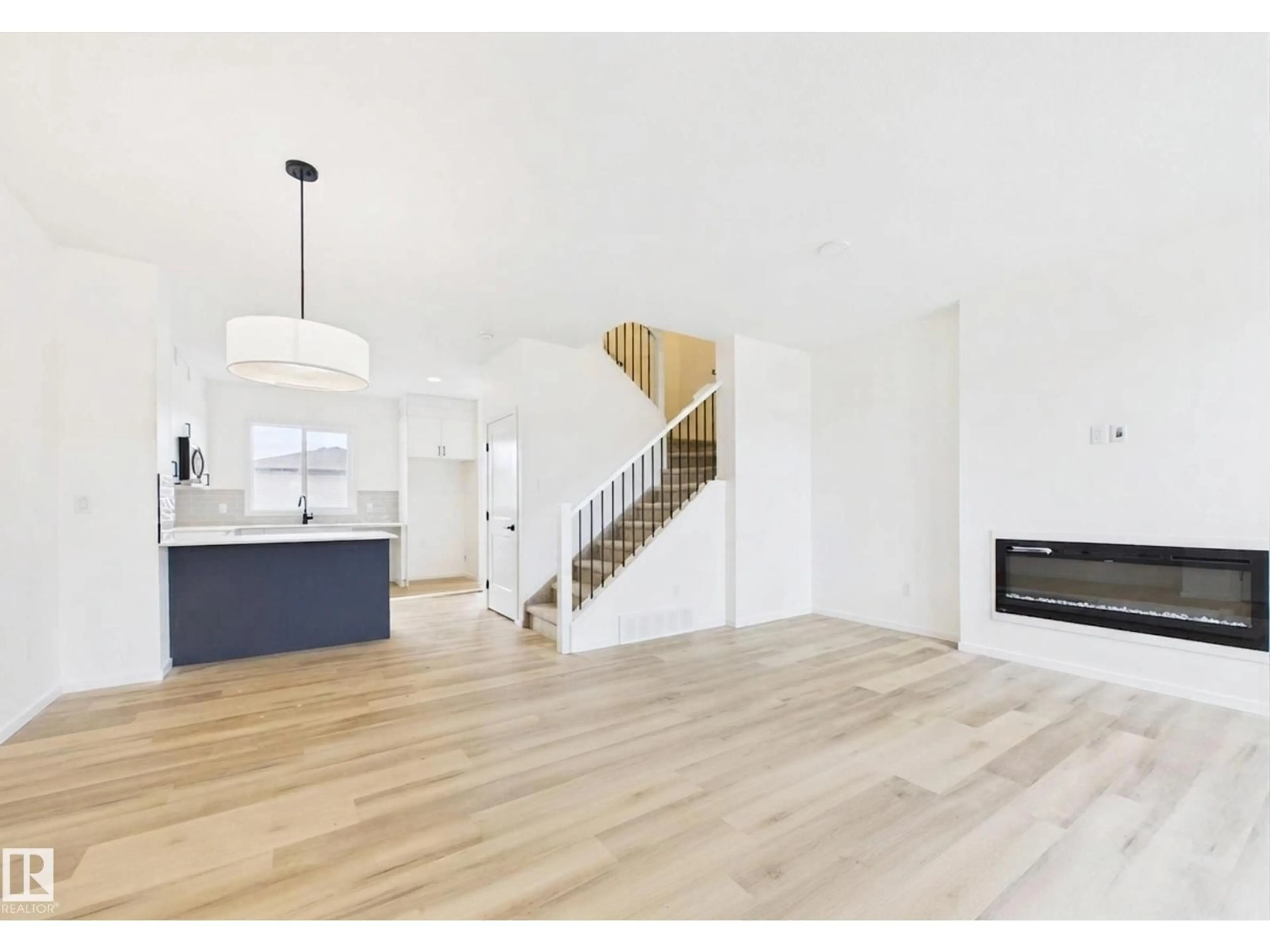 Open concept kitchen, wood/laminate floor for 115 BRICKYARD DR, Stony Plain Alberta T7Z0P2