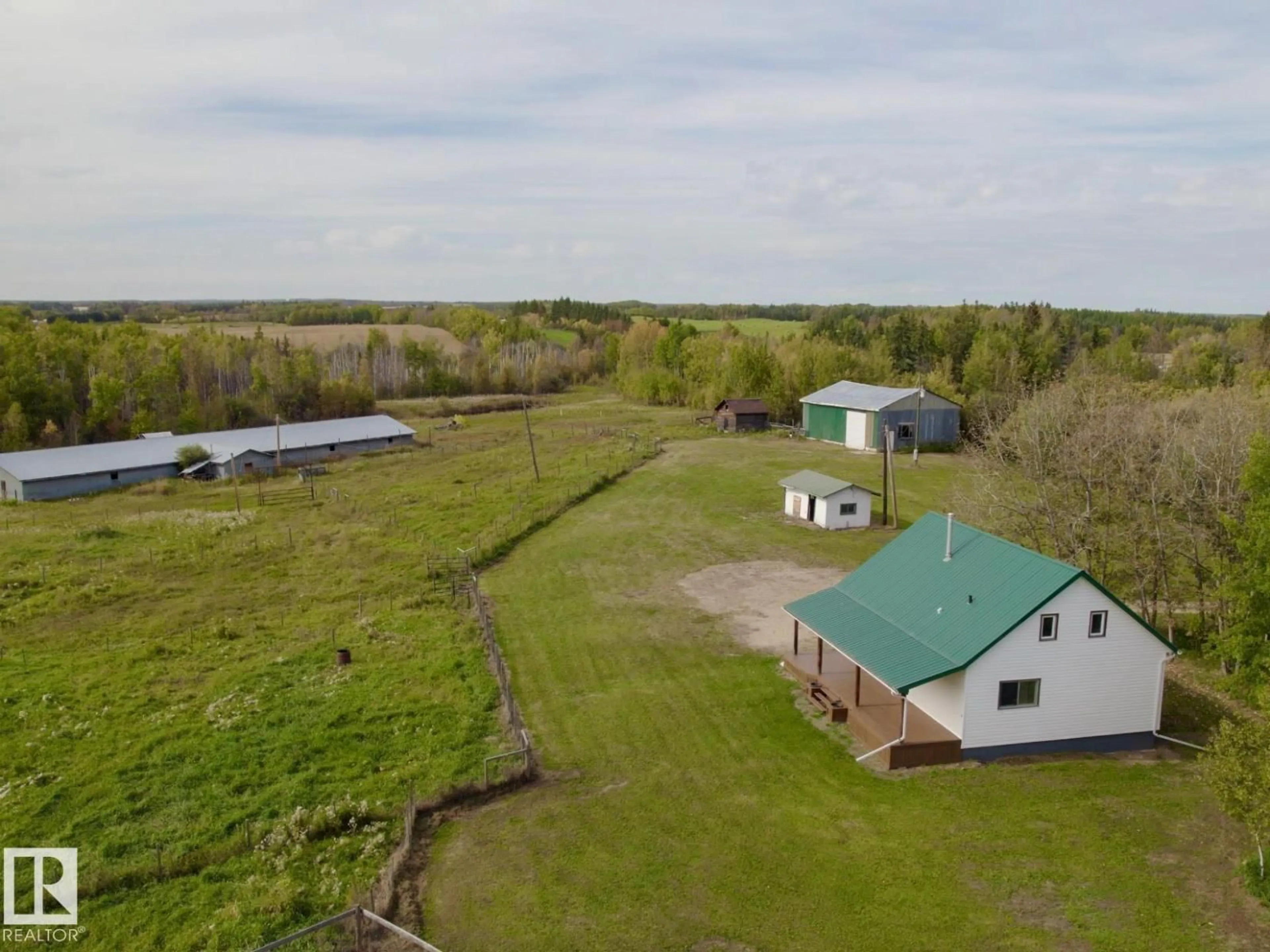 A pic from outside/outdoor area/front of a property/back of a property/a pic from drone, water/lake/river/ocean view for 4211 TWP RD 580, Rural Barrhead County Alberta T7N0J9