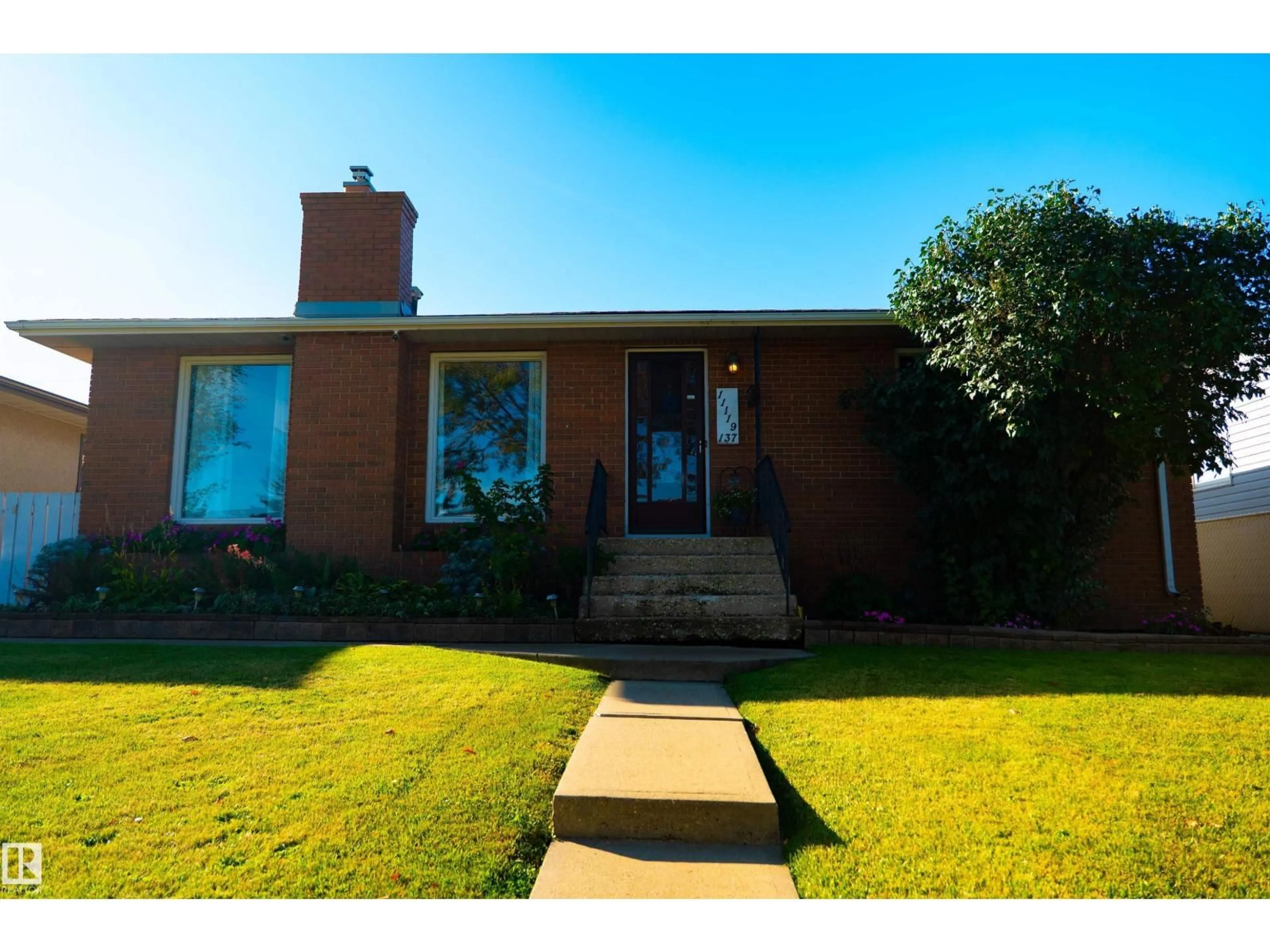 Home with brick exterior material, street for 11119 137 AV, Edmonton Alberta T5E1Z3